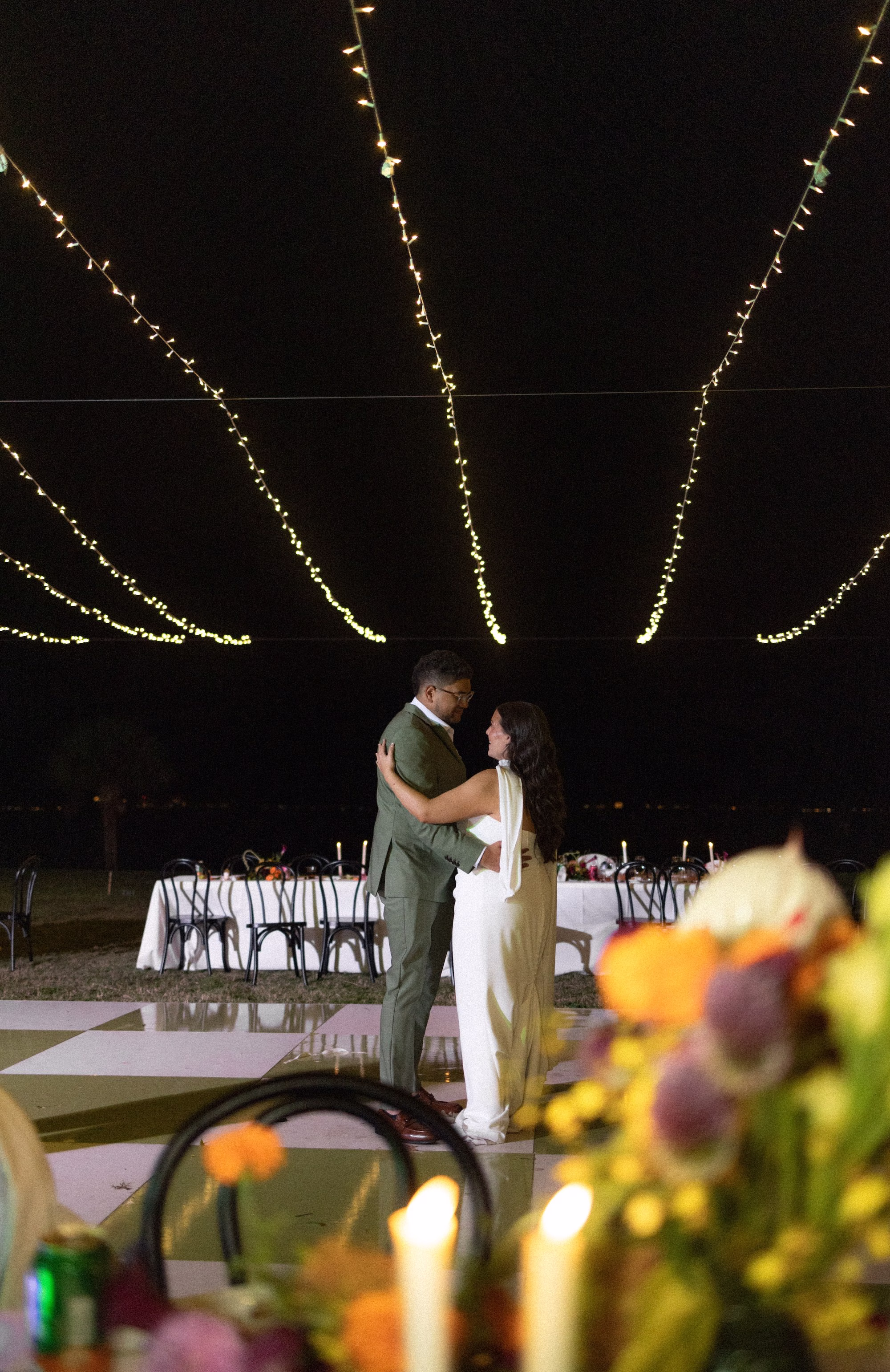 Bride and Groom First Dance Wedding Portrait | Sage Green and White Checkered Outdoor Dance Floor | Sarasota Event Venue Powel Crosley Estate