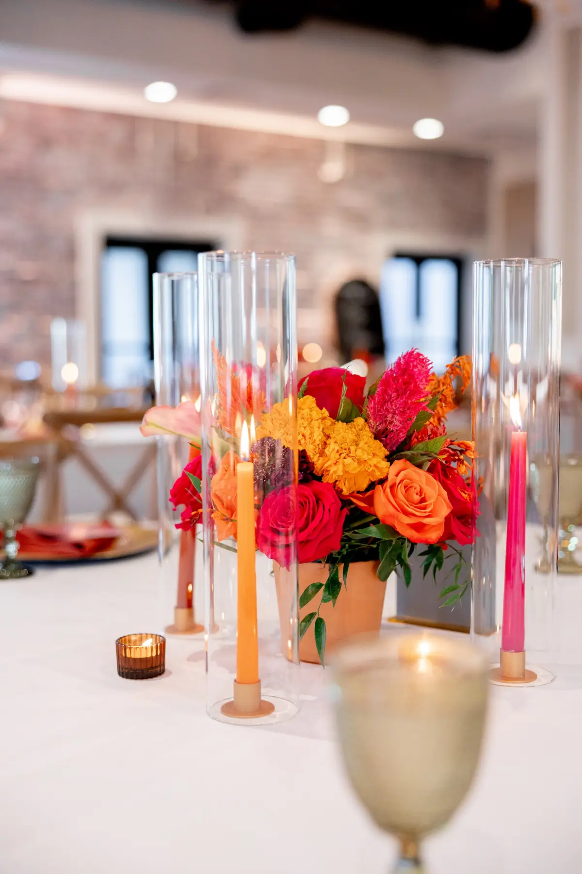 42Vibrant Southwestern Terracotta Pink and Orange Wedding Ideas - Vibrant, Rooftop Wedding Inspiration Shoot | Red Mesa Events Vibrant Southwest Mexican Wedding Reception Ideas | Bright Pink, Orange, Rust Red, Floral Arrangements Centerpiece Arrangements in Terracotta Pots Reception Decoration Inspiration | Romantic Pink and Orange Taper Candles in Glass Vases Tablescape Decor Ideas | Tampa Bay Florist Save The Date Florida | St Pete Event Planner Coastal Coordinating | Downtown St Pete Event Venue Red Mesa Events | St Pete Rentals Gabro Event Services