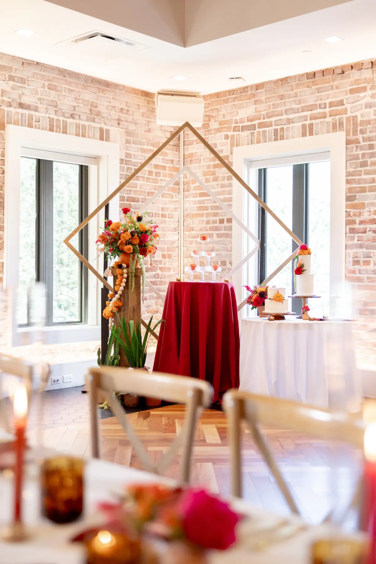 44Vibrant Southwestern Terracotta Pink and Orange Wedding Ideas St Pete Venue Red Mesa Events - Vibrant, Rooftop Wedding Inspiration Shoot | Red Mesa Events Southwestern Ballroom with Textured Brick Wall Wedding Reception | Vibrant Southwest Mexican Wedding Reception Ideas | Bright Pink, Orange, Rust Red Florals Arrangements Reception Decor Inspiration | Diamond Geometric Shape Sweetheart Table with Bold Red Table Linens Decor Ideas | Tampa Bay Florist Save The Date Florida | St Pete Event Planner Coastal Coordinating | St Pete Rentals Gabro Event Services