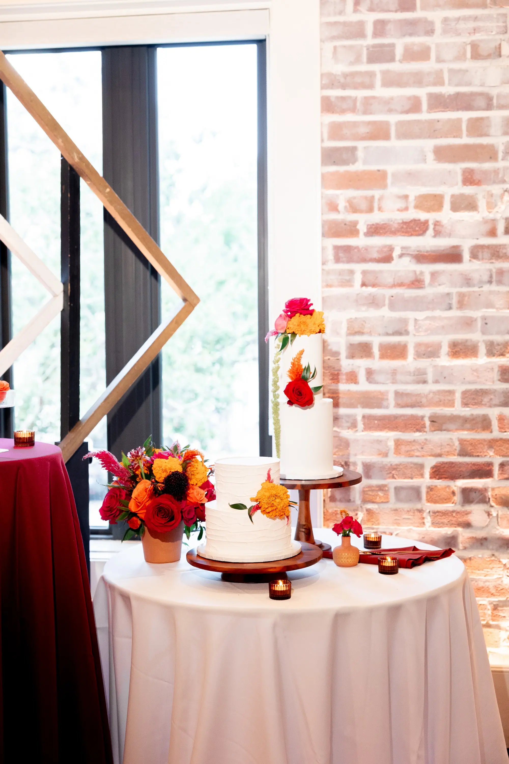 46Vibrant Southwestern Terracotta Pink and Orange Wedding Ideas - Vibrant, Rooftop Wedding Inspiration Shoot | Red Mesa Events Two Tier White Wedding Cake with Vibrant Pink and Red Roses, Yellow Orange Marigolds and Tropical Greenery Inspiration | Tampa Bay Florist Save The Date Florida | St Pete Event Planner Coastal Coordinating