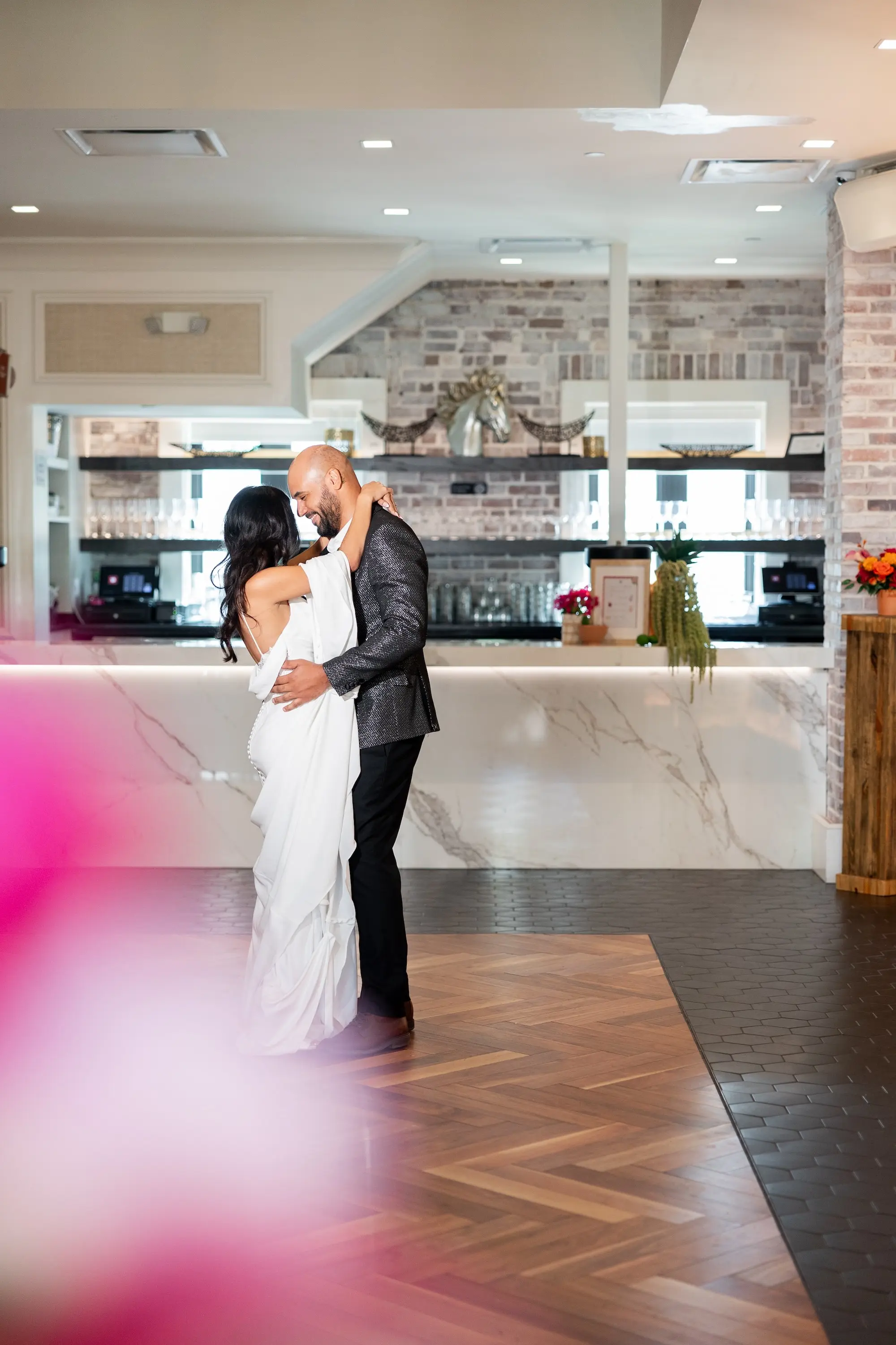 47Vibrant Southwestern Terracotta Pink and Orange Wedding Ideas St Pete Venue Red Mesa Events - Vibrant, Rooftop Wedding Inspiration Shoot | Red Mesa Events Bride and Groom First Dance Wedding Portrait | Tampa Bay Photographer Pine and Forge Photography | Content Creator Behind The Vows