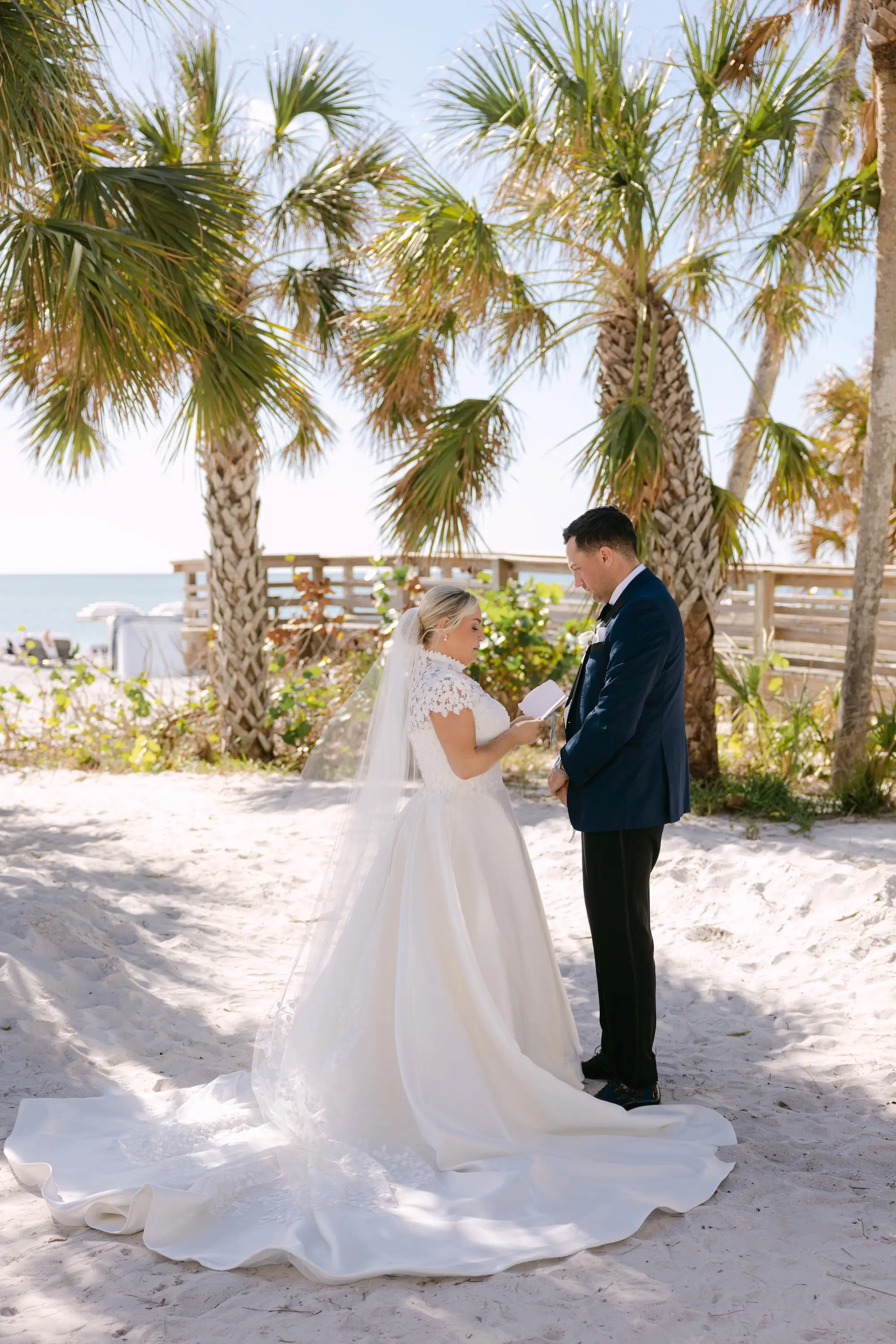 11Tropical Red and Orange Outdoor Florida Destination Wedding - Tropical Outdoor Sarasota Wedding | The Resort at Longboat Key Club Bride and Groom First Look Private Vow Wedding Portrait