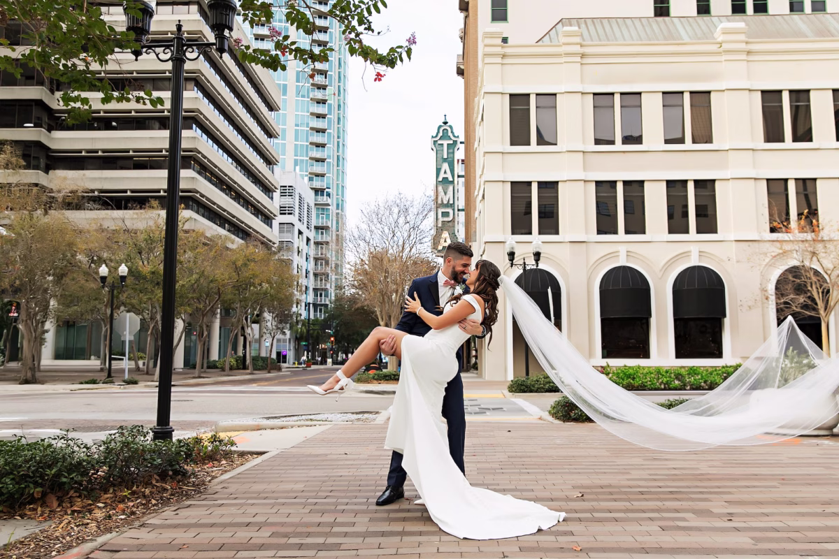 15Elegant Navy Blue and Blush PInk Wedding Ideas - Elegant, Navy and Blush Downtown Tampa Wedding | The Vault Bride and Groom Downtown Tampa Theater Marquee Wedding Portrait | White Off the Shoulder A-Line Stella Grace Wedding Gown with High Slit and Traditional Cathedral Length Tulle Veil Inspiration | Tampa Bay Photographer Limelight Photography
