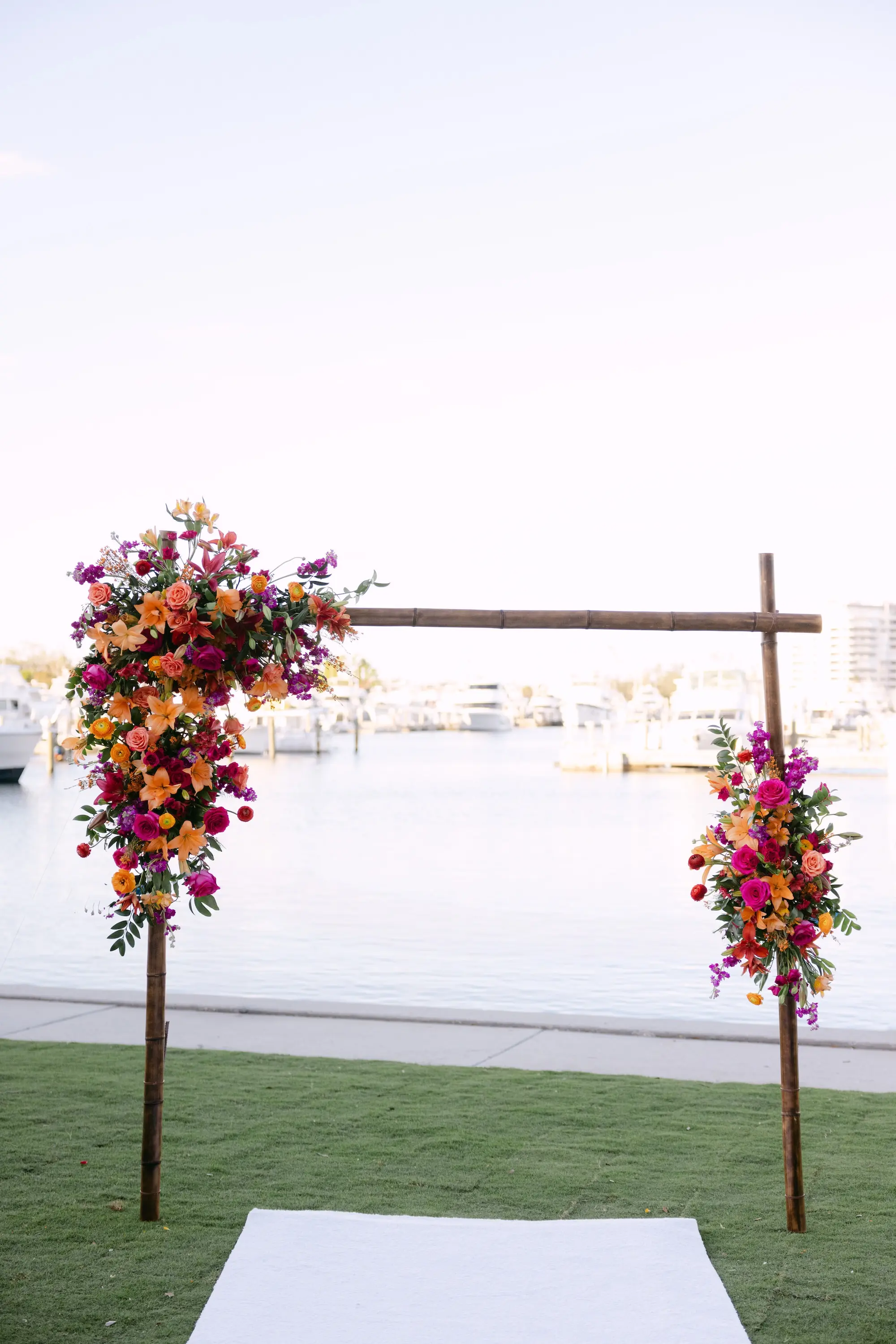 22Tropical Red and Orange Outdoor Florida Destination Wedding - Tropical Outdoor Sarasota Wedding | The Resort at Longboat Key Club Tropical Red and Orange Outdoor Waterfront Wedding Ceremony Arch Decor Ideas