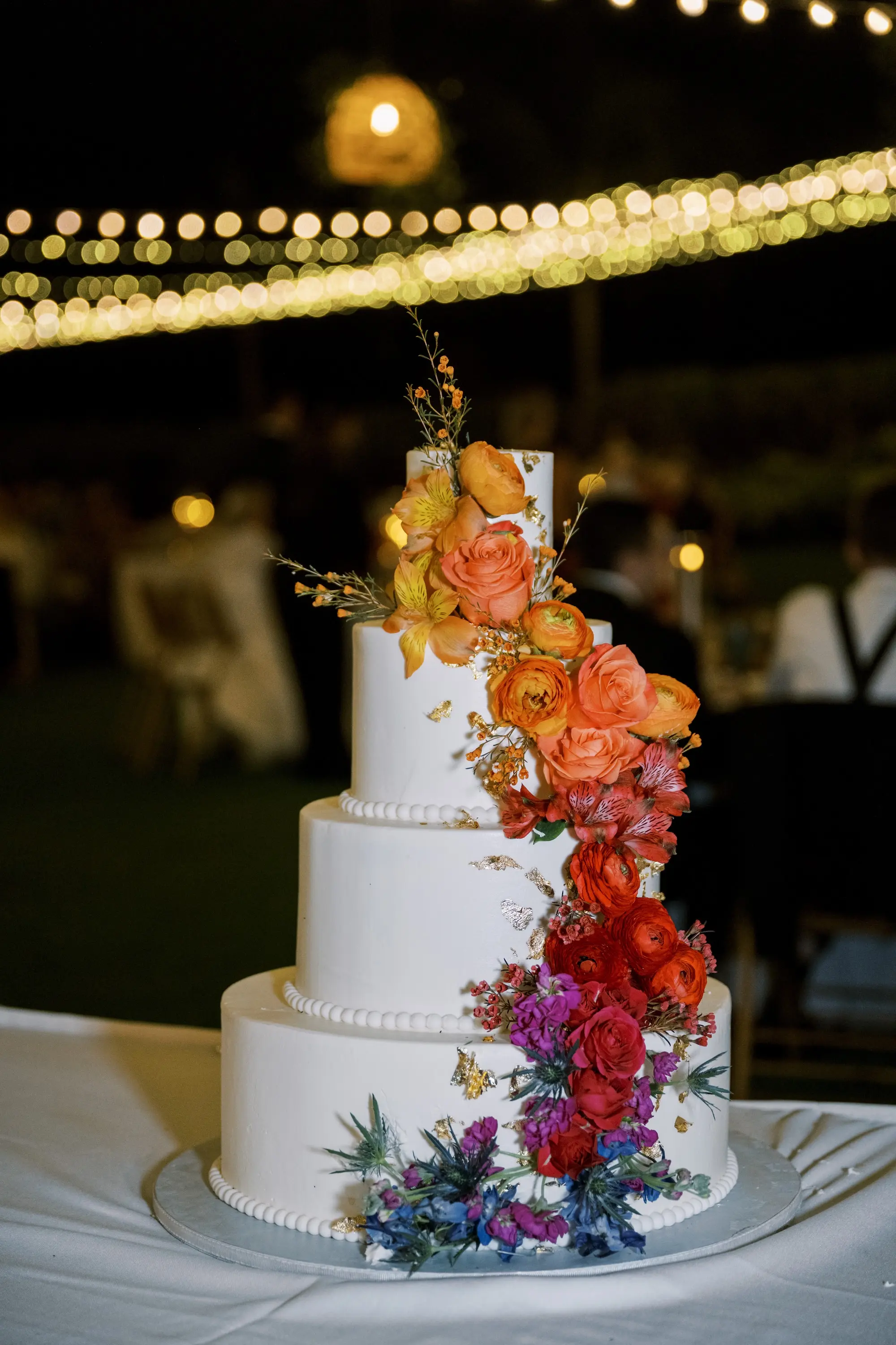 54Tropical Red and Orange Outdoor Florida Destination Wedding - Tropical Outdoor Sarasota Wedding | The Resort at Longboat Key Club White Round Four-Tiered Wedding Cake with Colorful Flowers Inspiration