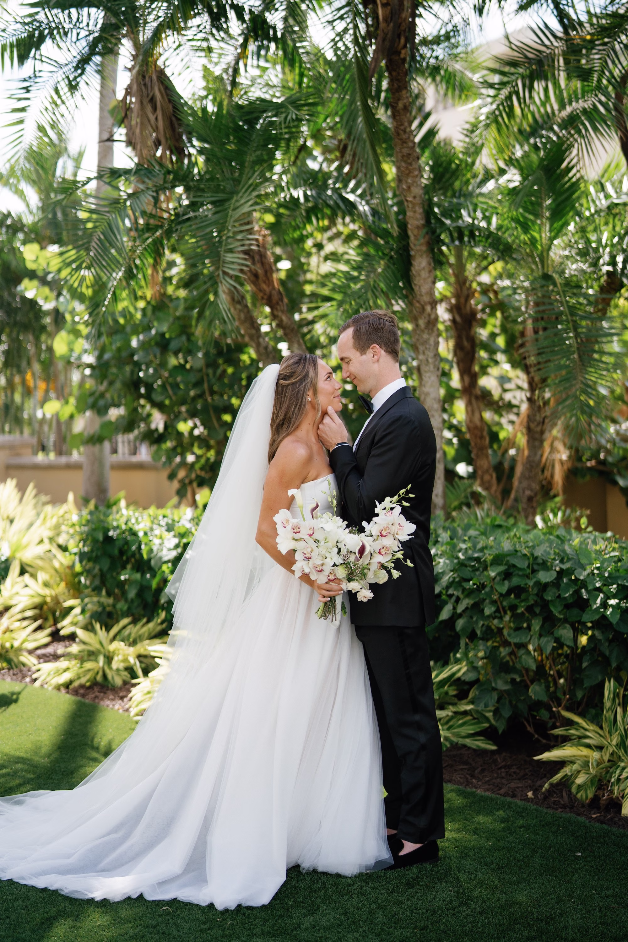 13Elegant Florida Garden Party Wedding Inspiration - Luxurious Garden Destination Wedding | Ritz-Carlton, Sarasota Bride and Groom Outdoor Wedding Portrait | White Orchids and Calla Lilies Bridal Wedding Bouquet Inspiration | White Strapless Ballgown Dress Ideas | Traditional Cathedral Length Tulle Veil Inspiration