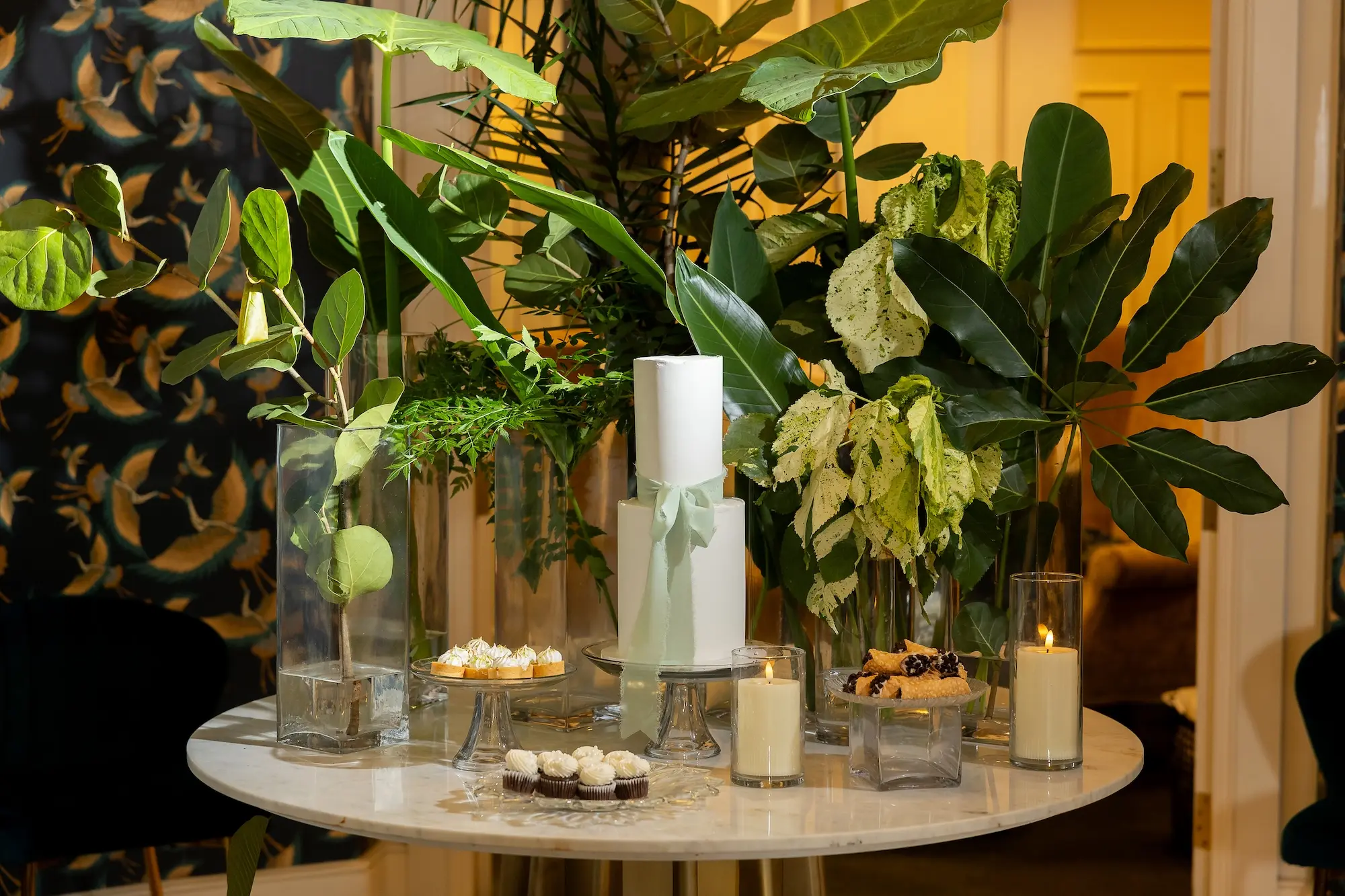 White Two Tier Simple Wedding Cake Ideas | Tranquil Calm Wedding Reception Decor Inspiration | Candlelight and Tropical Palm Greenery Decor Ideas
