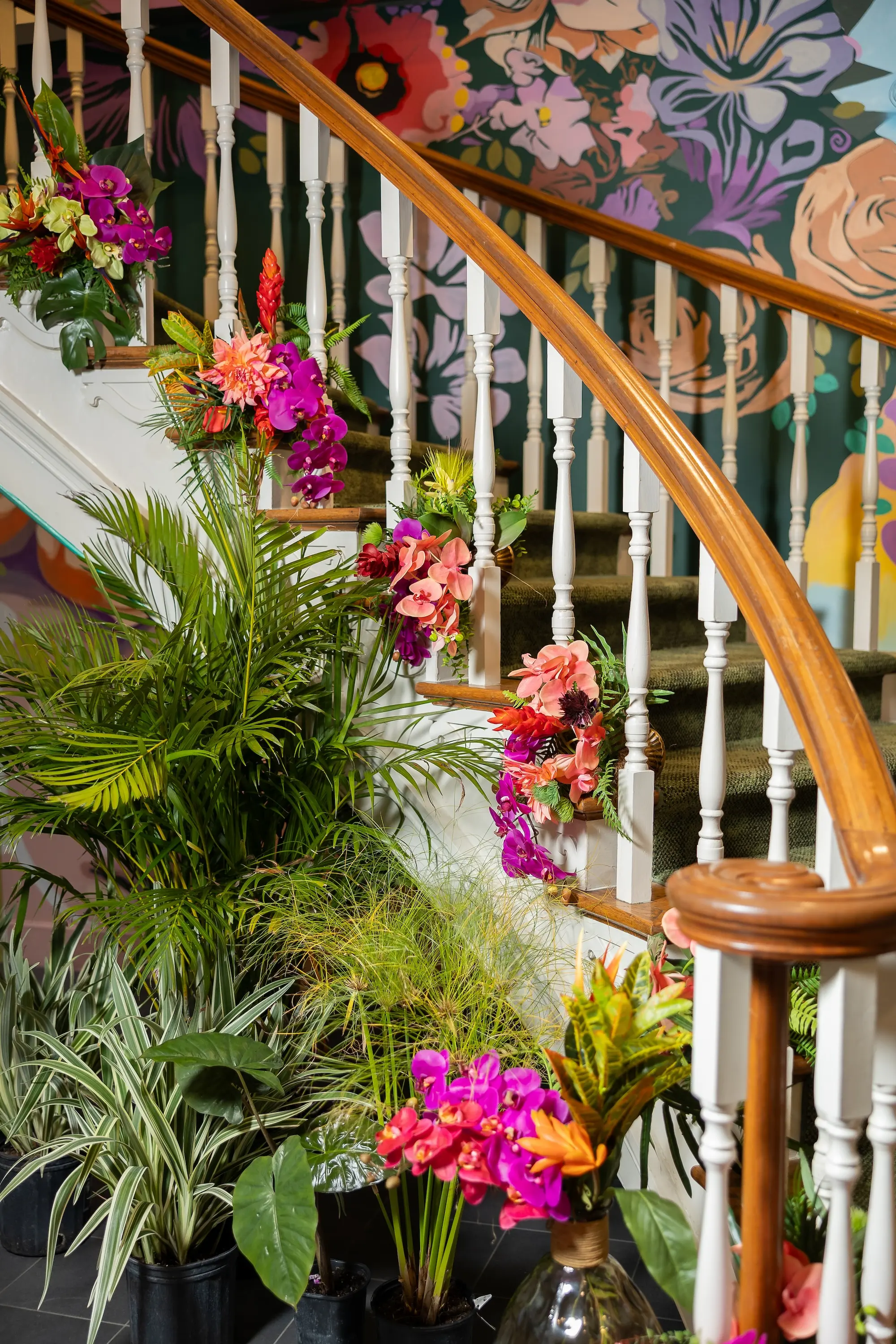 Vibrant Tropical Wedding Reception Floral Arrangement Decor Inspiration, Bright Pink, Orange Orchids, Red, Yellow Florals and, Lush Green Palms and Grasses Decor Ideas | Elegant Bold Wedding Reception Decor Inspiration