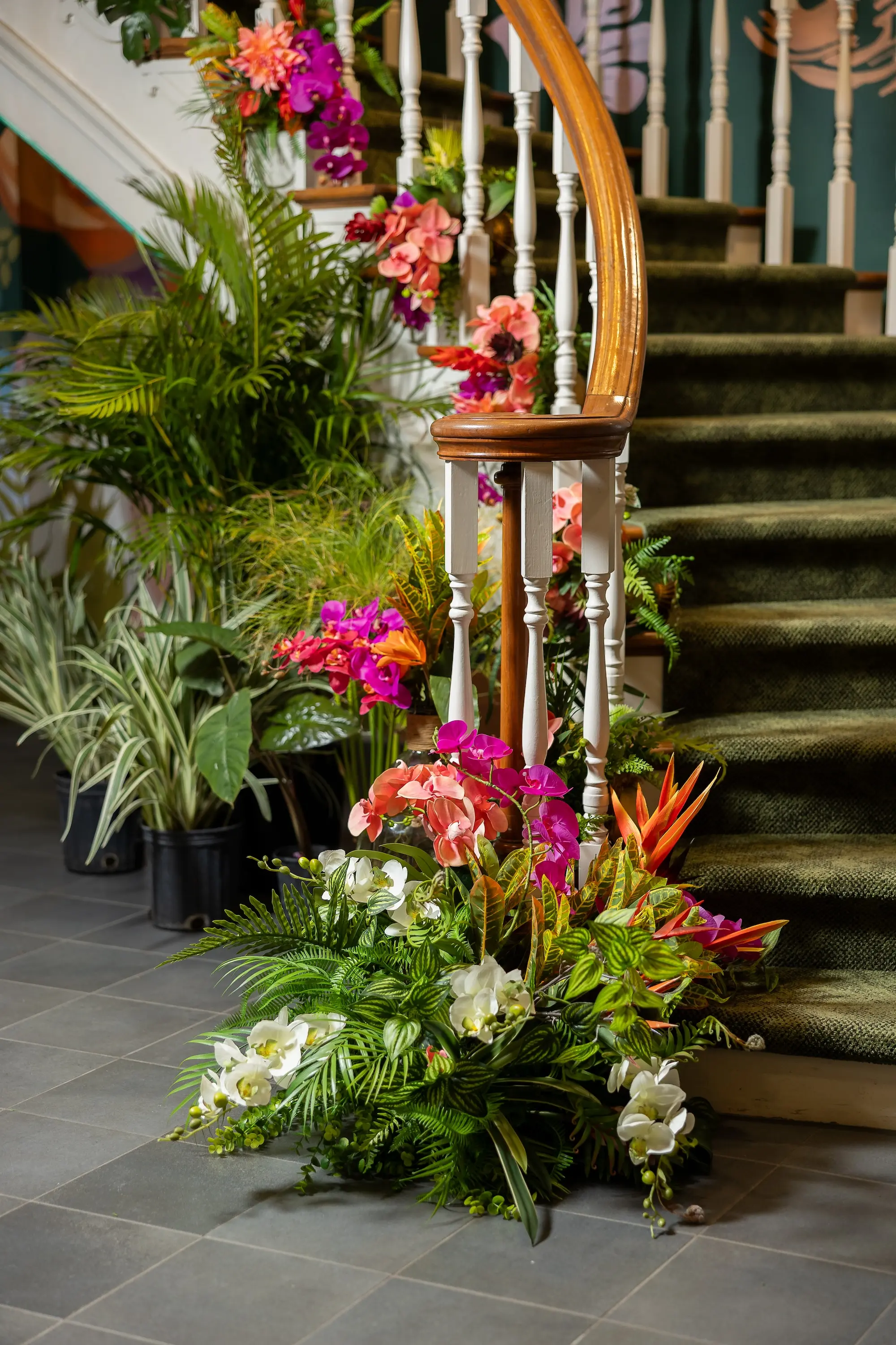 Vibrant Tropical Wedding Reception Floral Arrangement Decor Inspiration, Bright Pink, Orange Orchids, Red, Yellow Florals and, Lush Green Palms and Grasses Decor Ideas | Elegant Bold Wedding Reception Decor Inspiration