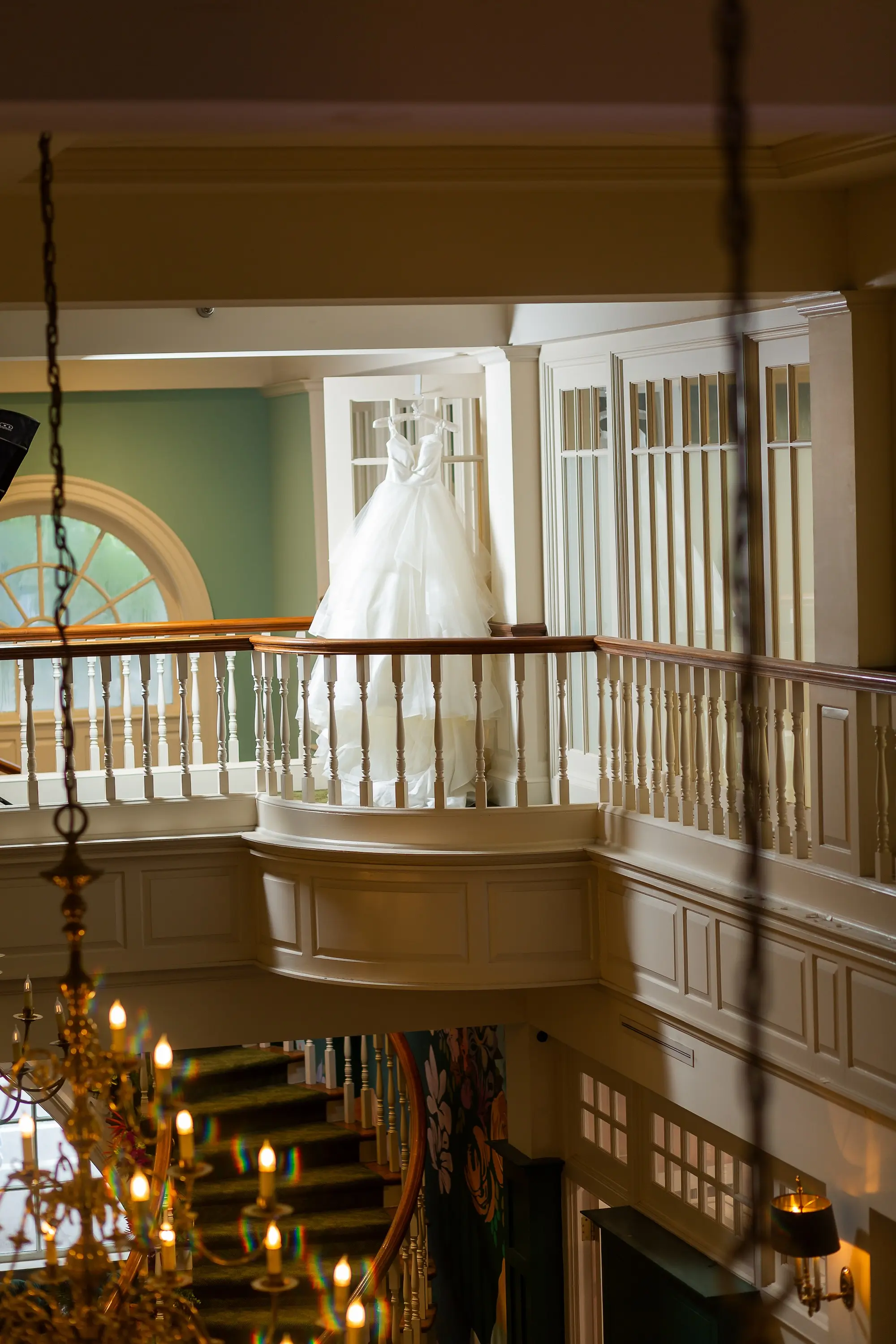Modern Classic Wedding Inspiration | White Strapless Wedding Ballgown at top of Balcony at The Spiral Staircase | Tampa Bay Wedding Venue Inspiration | Sarasota Boutique Truly Forever Bridal