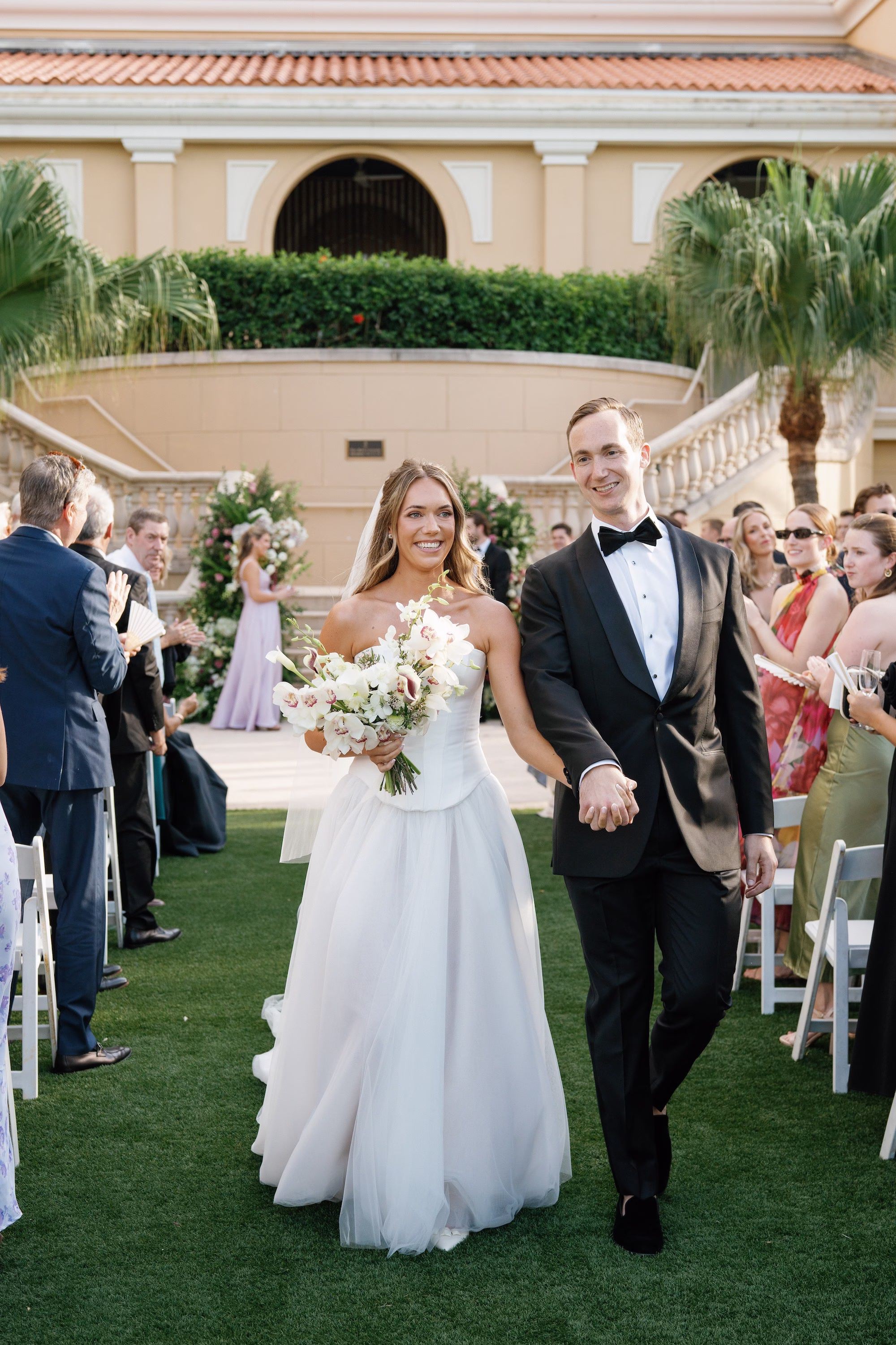 23Elegant Florida Garden Party Wedding Inspiration - Luxurious Garden Destination Wedding | Ritz-Carlton, Sarasota Bride and Groom Just Married Wedding Ceremony Portrait | White Orchids and Calla Lilies Bridal Wedding Bouquet Inspiration | White Strapless Ballgown Dress Ideas | Traditional Cathedral Length Tulle Veil Inspiration | White Folding | Garden Ceremony Chairs Ideas | Tampa Bay Planner MDP Events | Event Venue Ritz Carlton Sarasota