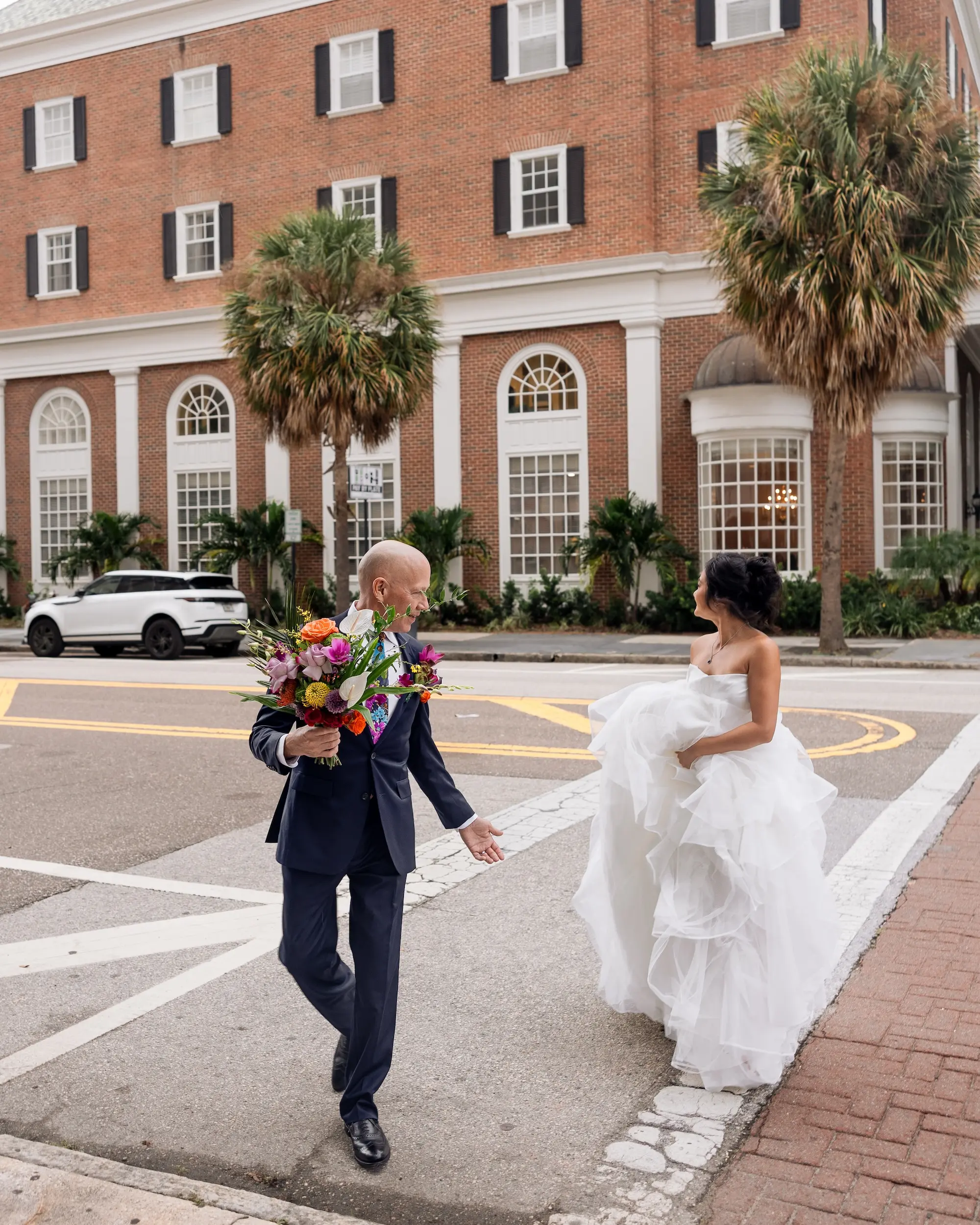 Modern Classic Wedding Inspiration | White Strapless Ballgown with Tiered, Ruffled Skirt Ideas | Bright Jewel Toned Tropical Floral Bridal Bouquet with Greene Palms Ideas | Tampa Bay Boutique Truly Forever Bridal