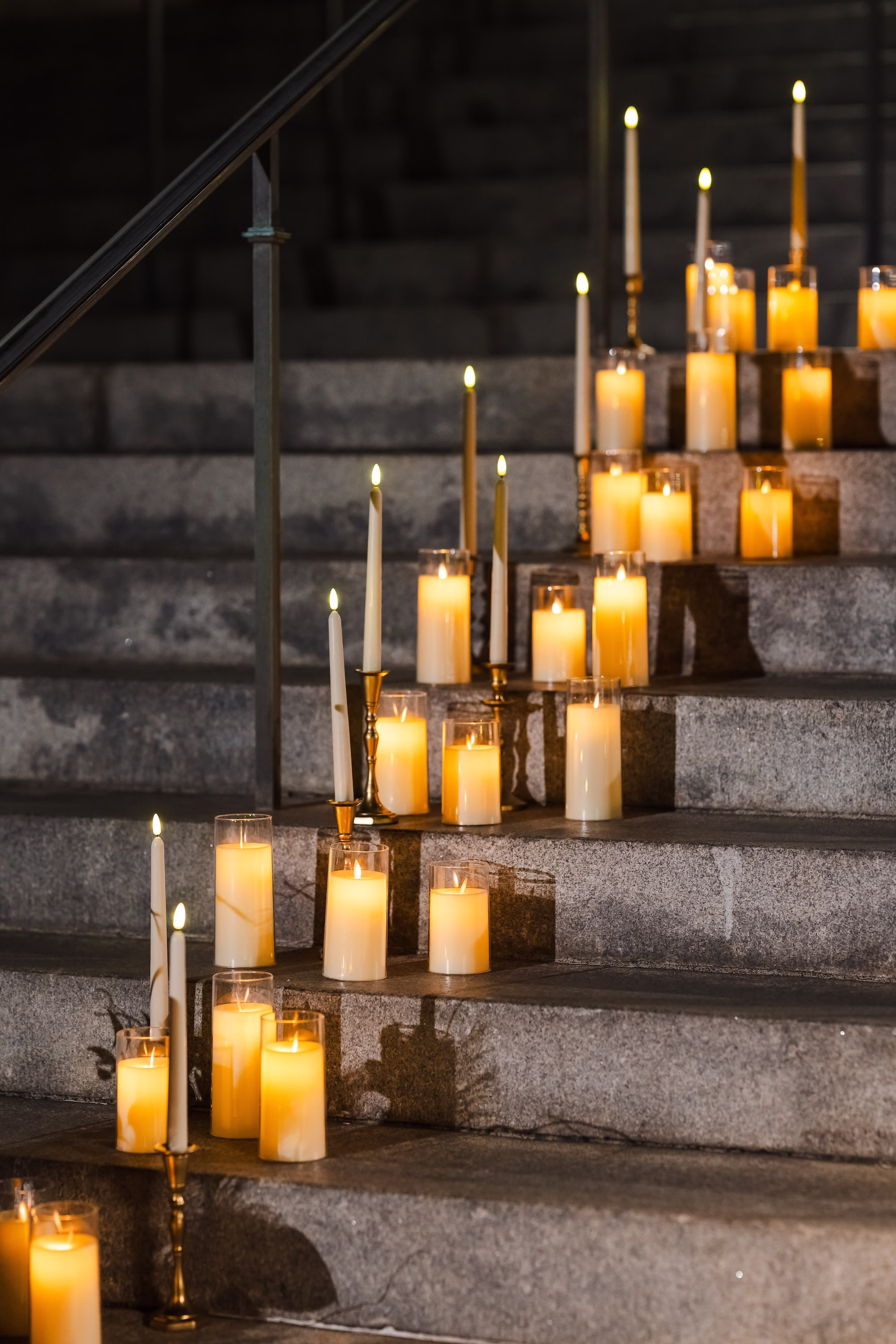 Dark and Moody Wedding Ceremony with Candles on Stairs Decor Inspiration