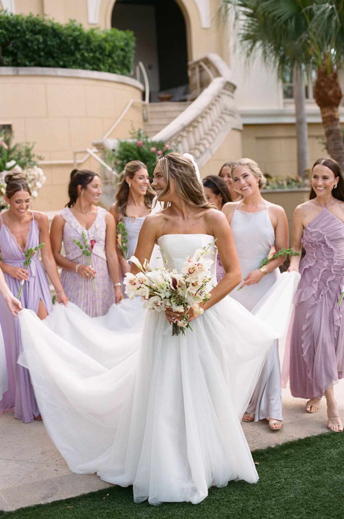 7Elegant Florida Garden Party Wedding Inspiration - Luxurious Garden Destination Wedding | Ritz-Carlton, Sarasota Bride and Bridesmaids Wedding Portrait | Mismatch Lilac Bridesmaid Dresses Inspiration | White Calla Lilies and Orchid Bridal Bouquet Ideas
