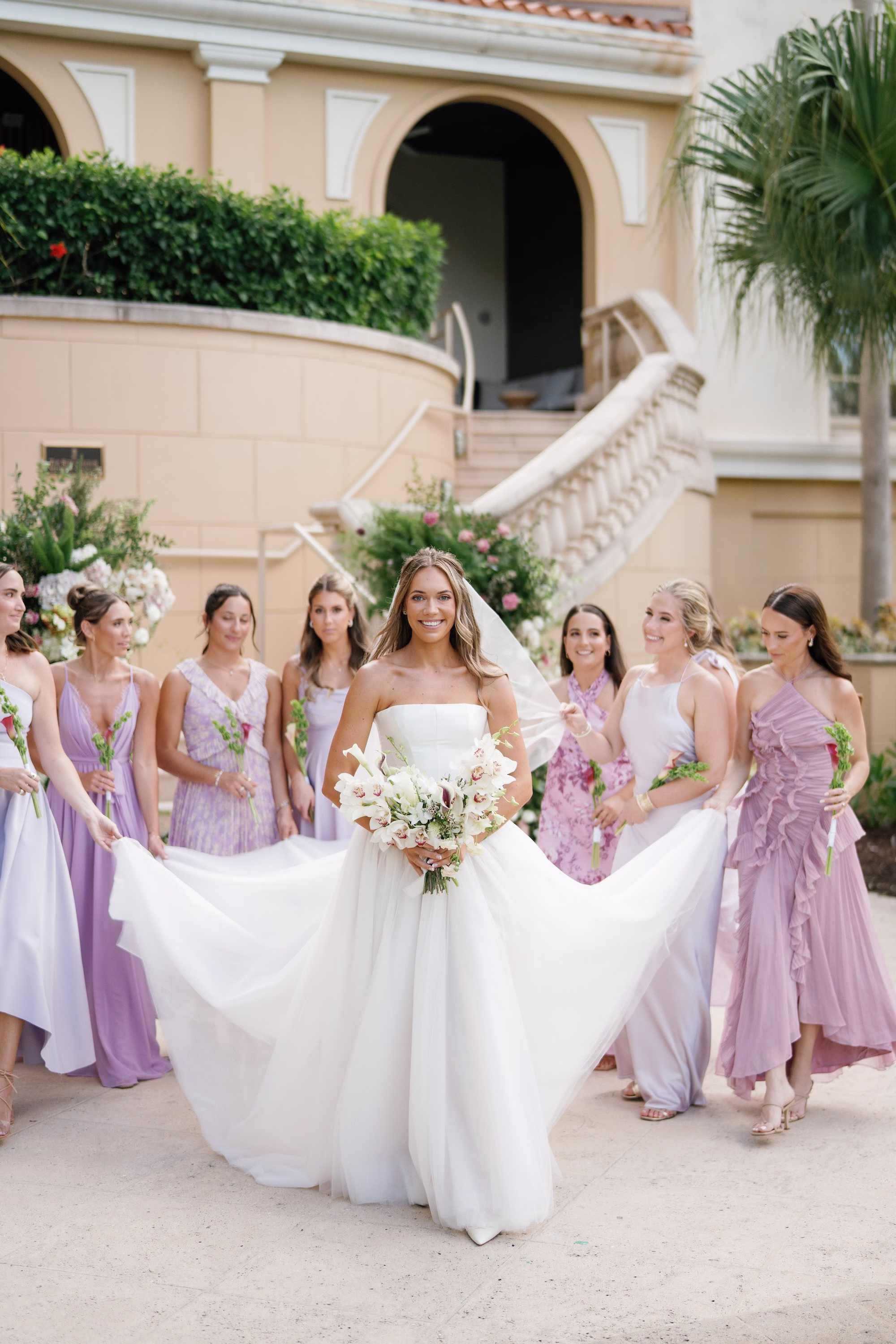 8Elegant Florida Garden Party Wedding Inspiration - Luxurious Garden Destination Wedding | Ritz-Carlton, Sarasota Bride and Bridesmaids Wedding Portrait | Mismatch Lilac Bridesmaid Dresses Inspiration | White Calla Lilies and Orchid Bridal Bouquet Ideas