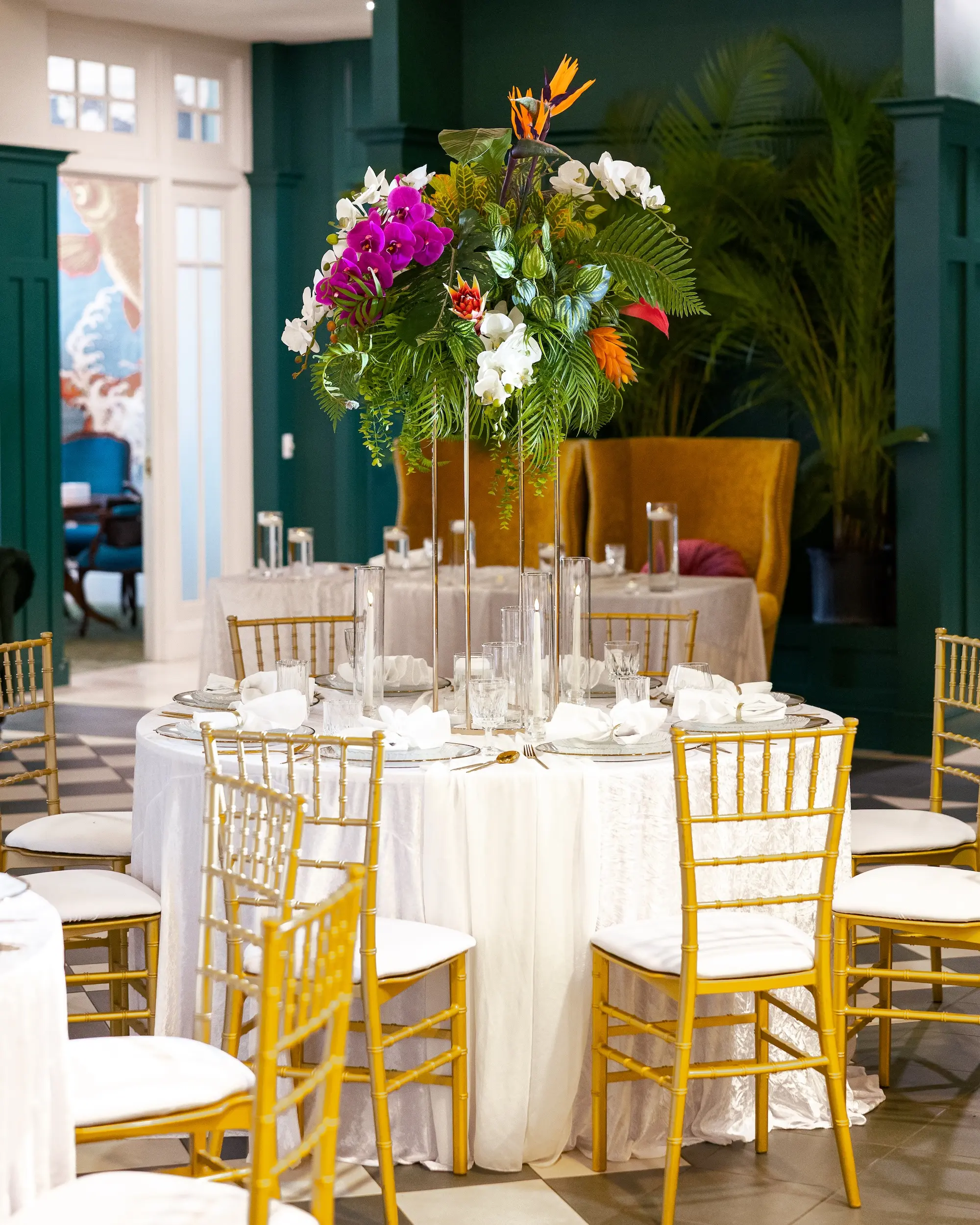 Modern Classic Wedding Ideas | Black and White Checkered Reception Floor Inspiration | White Linens with Gold Chiavari Chairs Ideas | Bright Jewel Toned Coral, Mauves and White Tropical Floral Centerpieces with Deep Green Palms and Greenery Decor Inspiration | Tampa Bay Wedding Venue The Spiral Staircase
