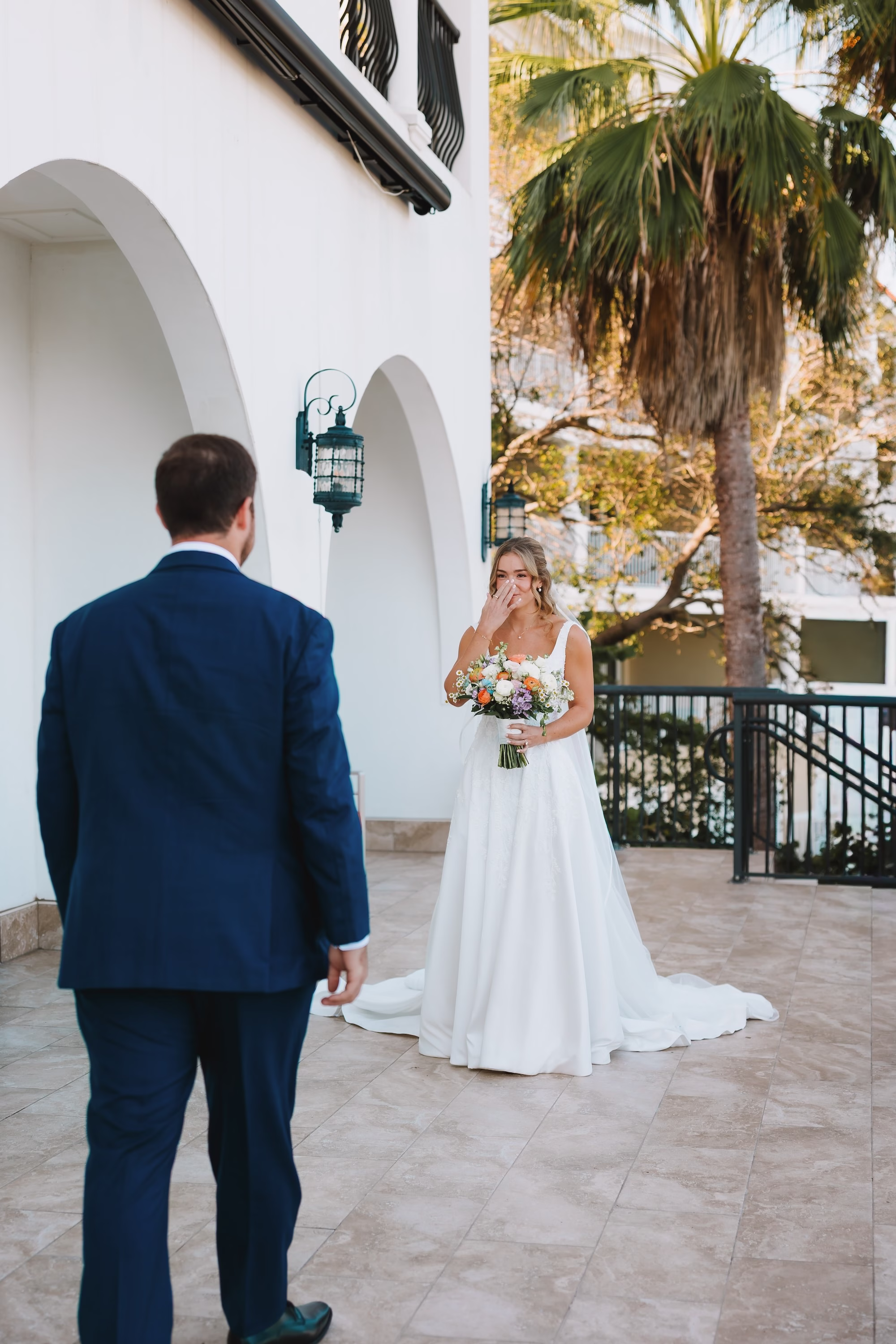 12Coastal Blue and White Rooftop Florida Wedding Ideas - Romantic Blue Coastal St. Pete Beach Wedding | The Hotel Zamora Bride and Groom First Look Wedding Portrait | Classic Half Up Half Down Bridal Hair with Veil Inspiration | Elegant White Magnolia White A-Line Wedding Gown with Square Neckline and Full Skirt Ideas | Sarasota Hair and Makeup Artist Femme Akoi Beauty Studio | St Pete Beach Wedding Venue Hotel Zamora