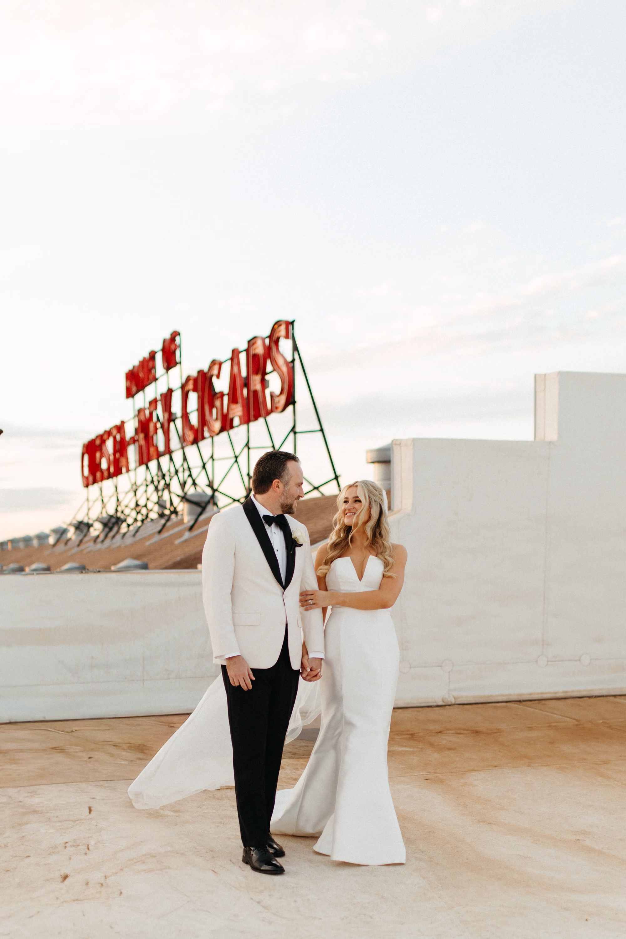 Bride and Groom Wedding Portrait | Timeless White White Magnolia Strapless A Line Wedding Gown with Cathedral Tulle Veil Inspiration | Tampa Bay Event Venue JC Newman Cigar Factory