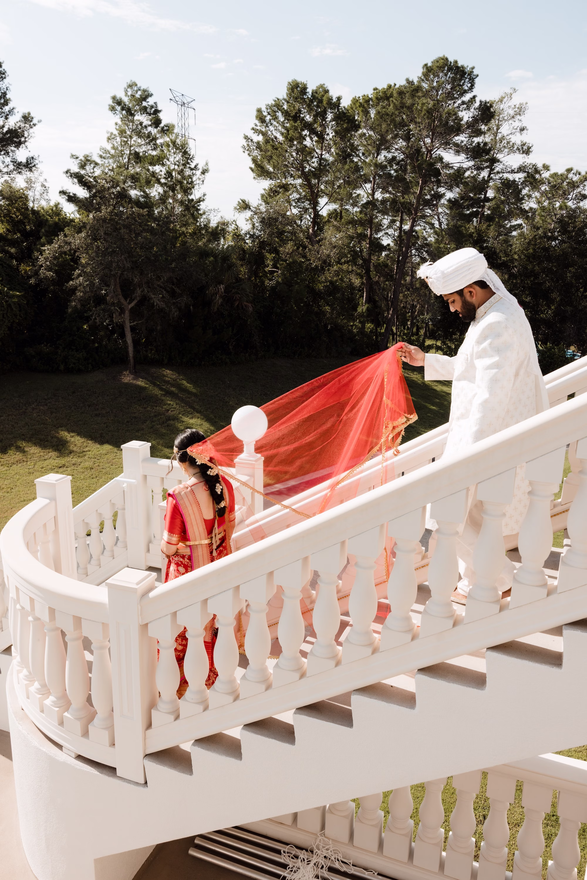Bride and Groom Wedding Portrait | Red and Gold Bridal Saree Inspiration | White Groom Sherwani, Churidar and Sehra Ideas | Traditional Indian Bride and Groom Attire Inspiration | Tampa Bay Event Venue Whitehurst Gallery | Photographer Evoke Photo and Film