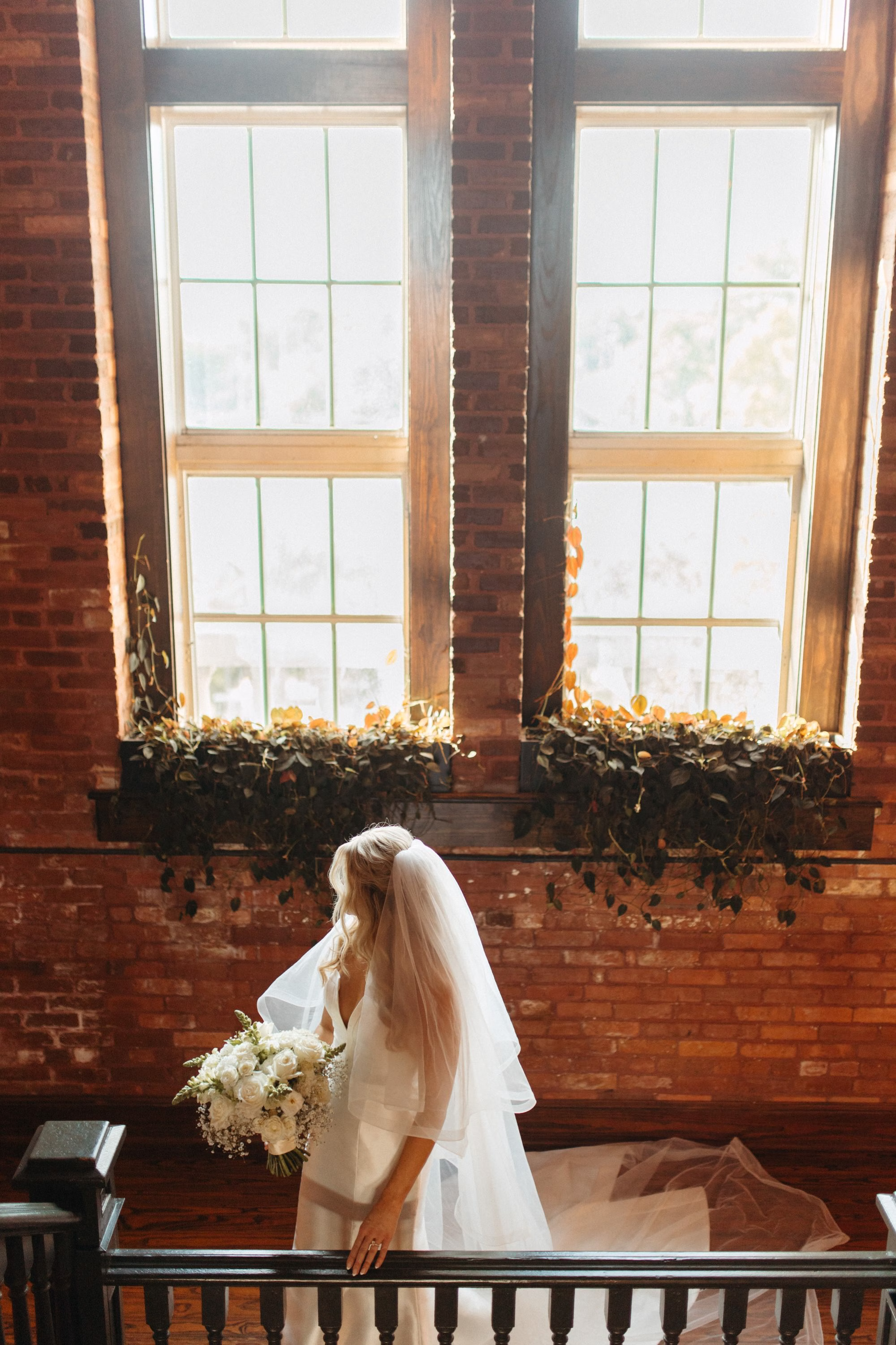 Bride Wedding Portrait | White Roses and Baby's Breath Bridal Bouquet with Satin Ribbon Inspiration Clearwater Florist Lemon Drops Wedding and Events | Historic Ybor Wedding Venue J.C. Newman Cigar Company