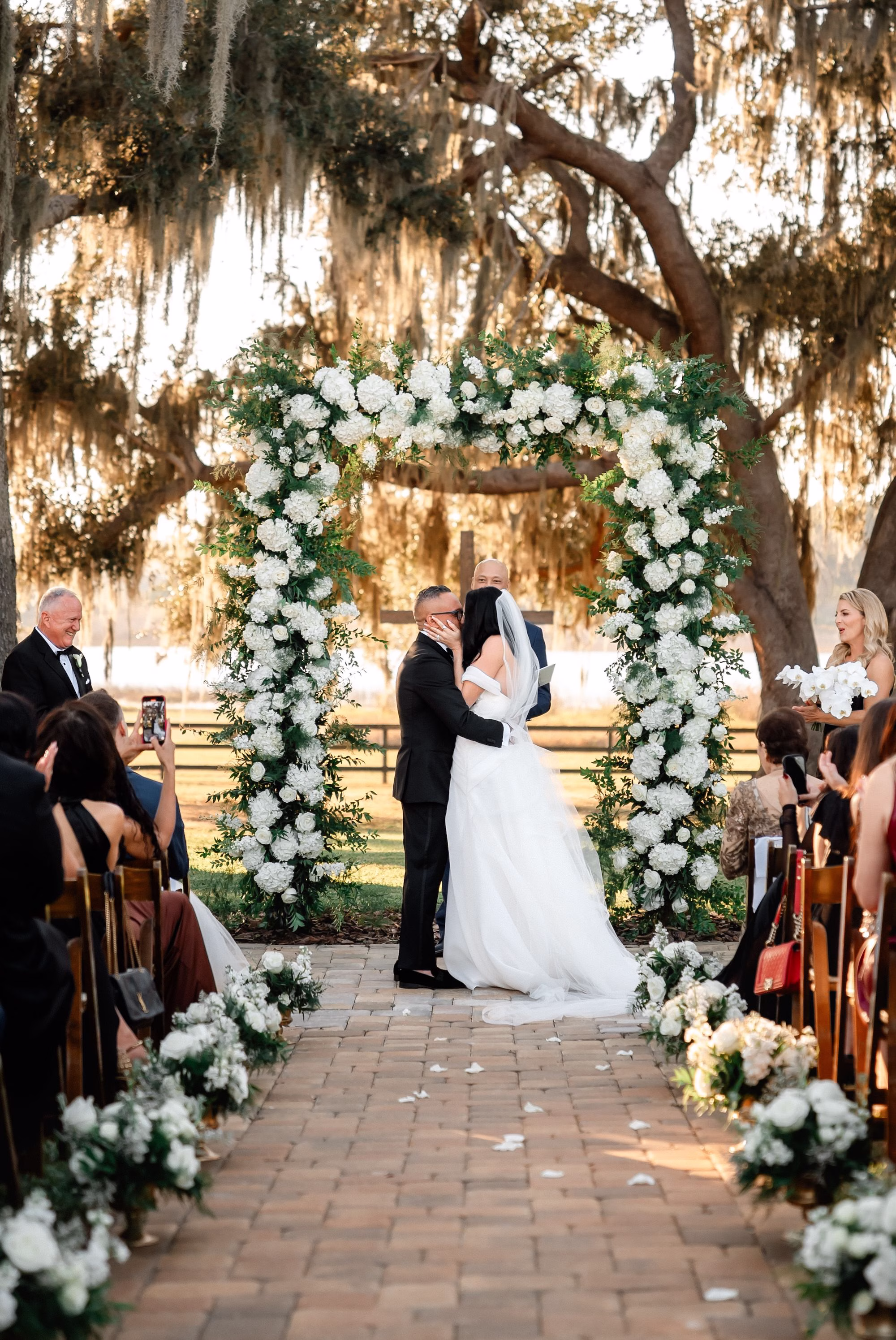 23Luxurious Old Florida Black White and Gold Wedding Inspiration - Luxurious, Black and White Dade City Wedding | The Barn at Covington Farm Bride and Groom First Kiss Wedding Portrait