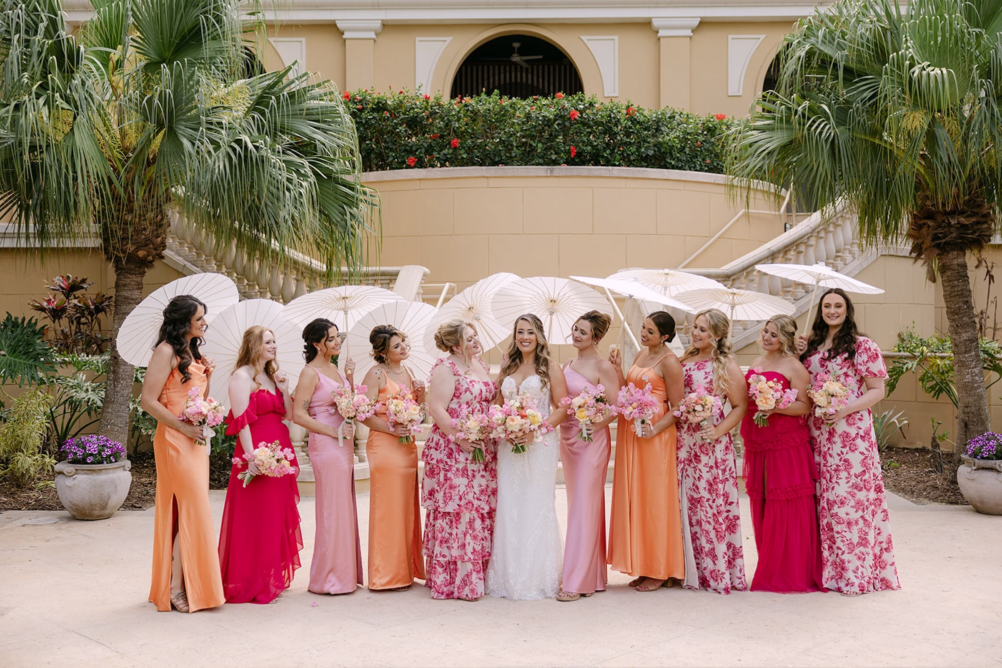27Luxurious Whimsical Colorful Tented Florida Wedding - Luxurious, Pastel Garden Tented Wedding | Ritz Carlton Sarasota Bride with Bridesmaids with Parasail Umbrellas Wedding Portrait | Pink, Floral, and Orange Bridesmaid Dress Inspiration | White Strapless Sophisticated Pronovias Fitted Wedding Gown with Intricate Beaded V-Neck Bodice Inspiration | Multicolor Pastel Blush, Yellow, Lavender Bridal Bouquet Ideas | Sarasota Boutique Truly Forever Bridal | Content Creator Behind The Vows | Tampa Bay Planner MDP Events