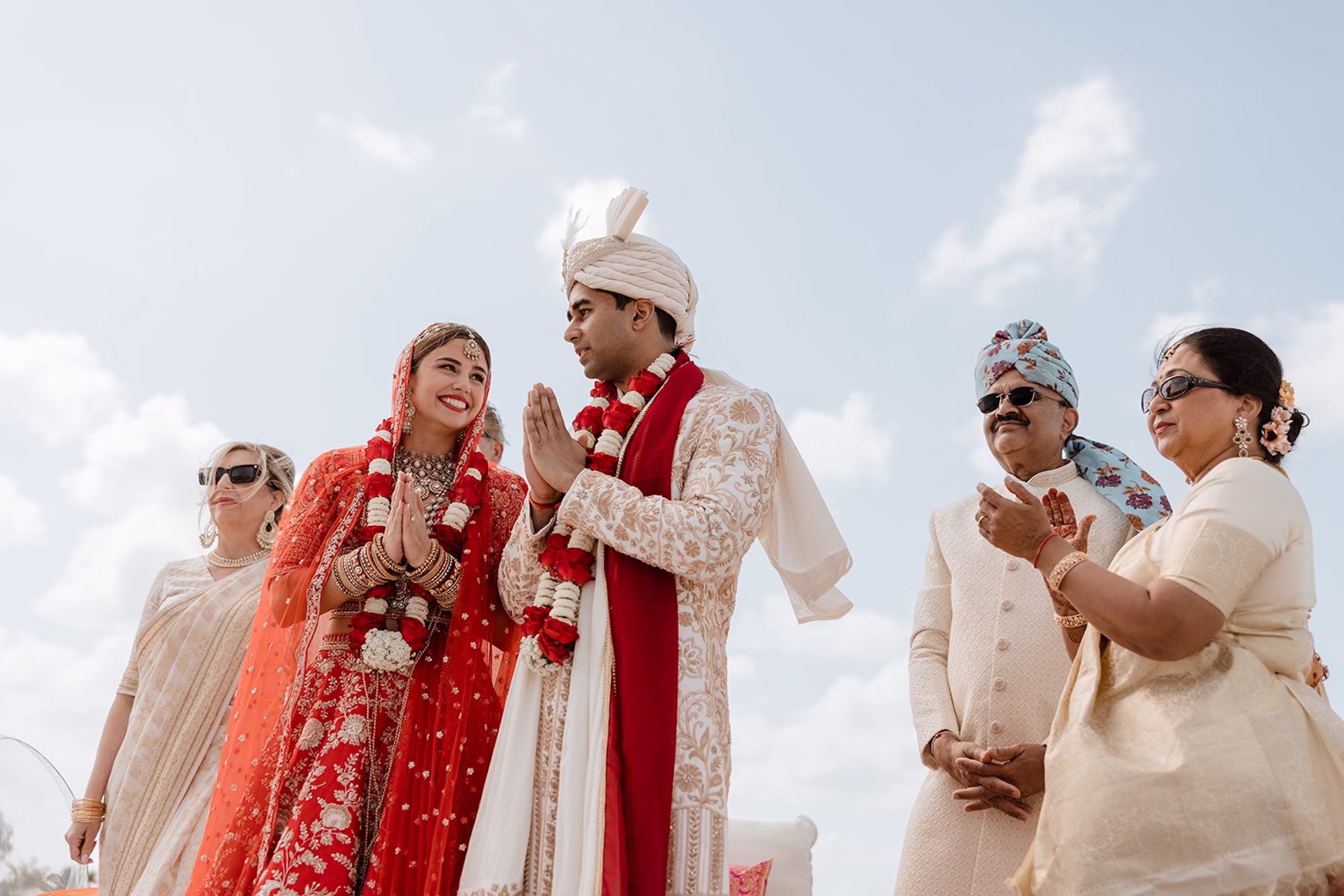 27Tropical Pink and Red Sarasota Beach Indian Wedding Ceremony - Vibrant Pink and Gold Multicultural Sarasota Wedding | Powel Crosley Estate Bride and Groom Traditional Indian Wedding Ceremony Wedding Portrait | Bright Red and Gold Bride Lehenga by Kalighata at Kynah Ideas | Groom Beaded Off-White Sherwani Inspiration | Indian Culture Wedding Ideas | Sarasota Beach Event Venue The Resort at Longboat Key Club | Photographer Evoke Photo and Film