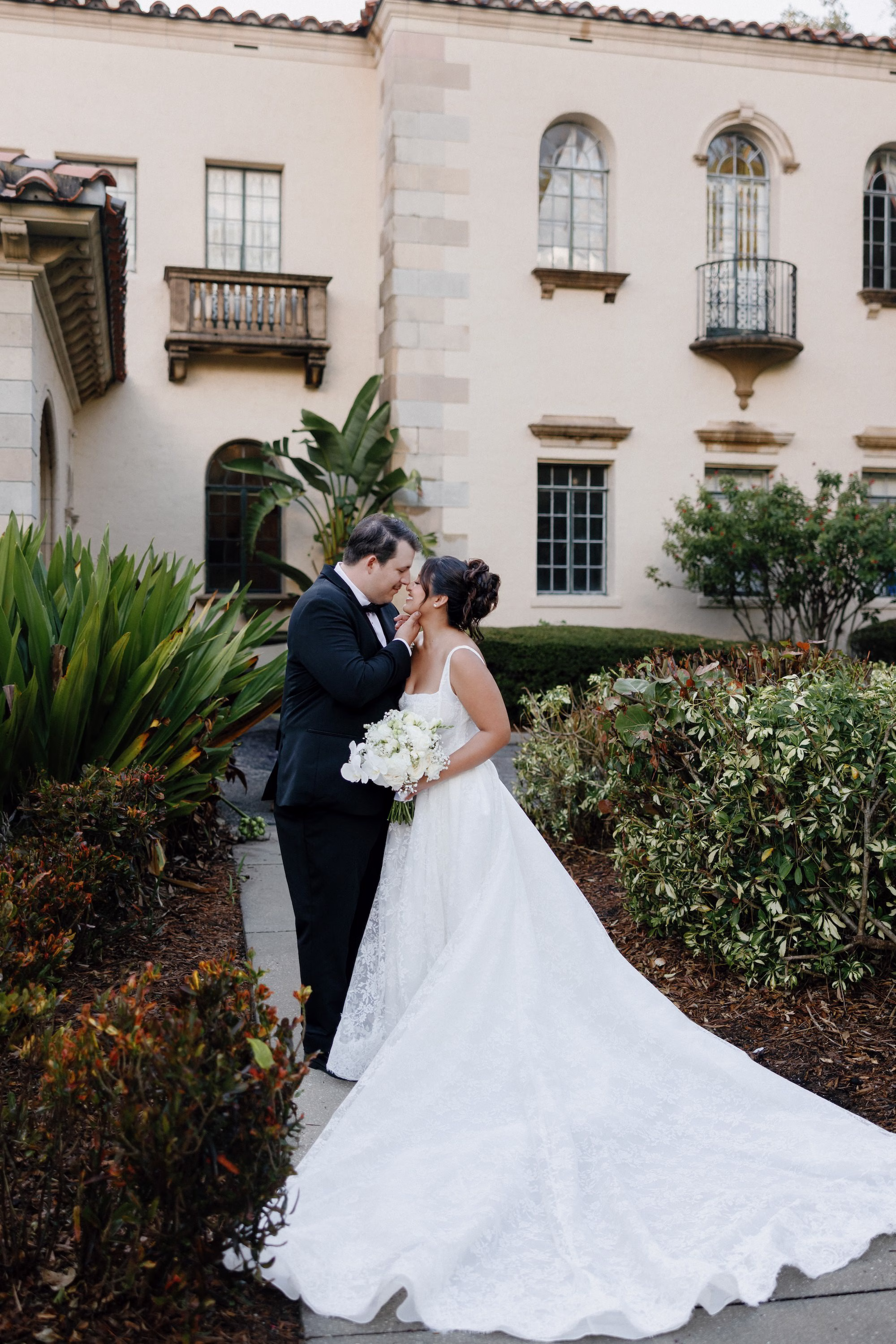 Bride and Groom Wedding Portrait | Classic Elegant White Wedding Gown with Square Neckline and Cathedral Length Train Inspiration | Monochromatic White Roses and Baby's Breath Bridal Bouquet Ideas | Tampa Bay Florist Save The Date Florida