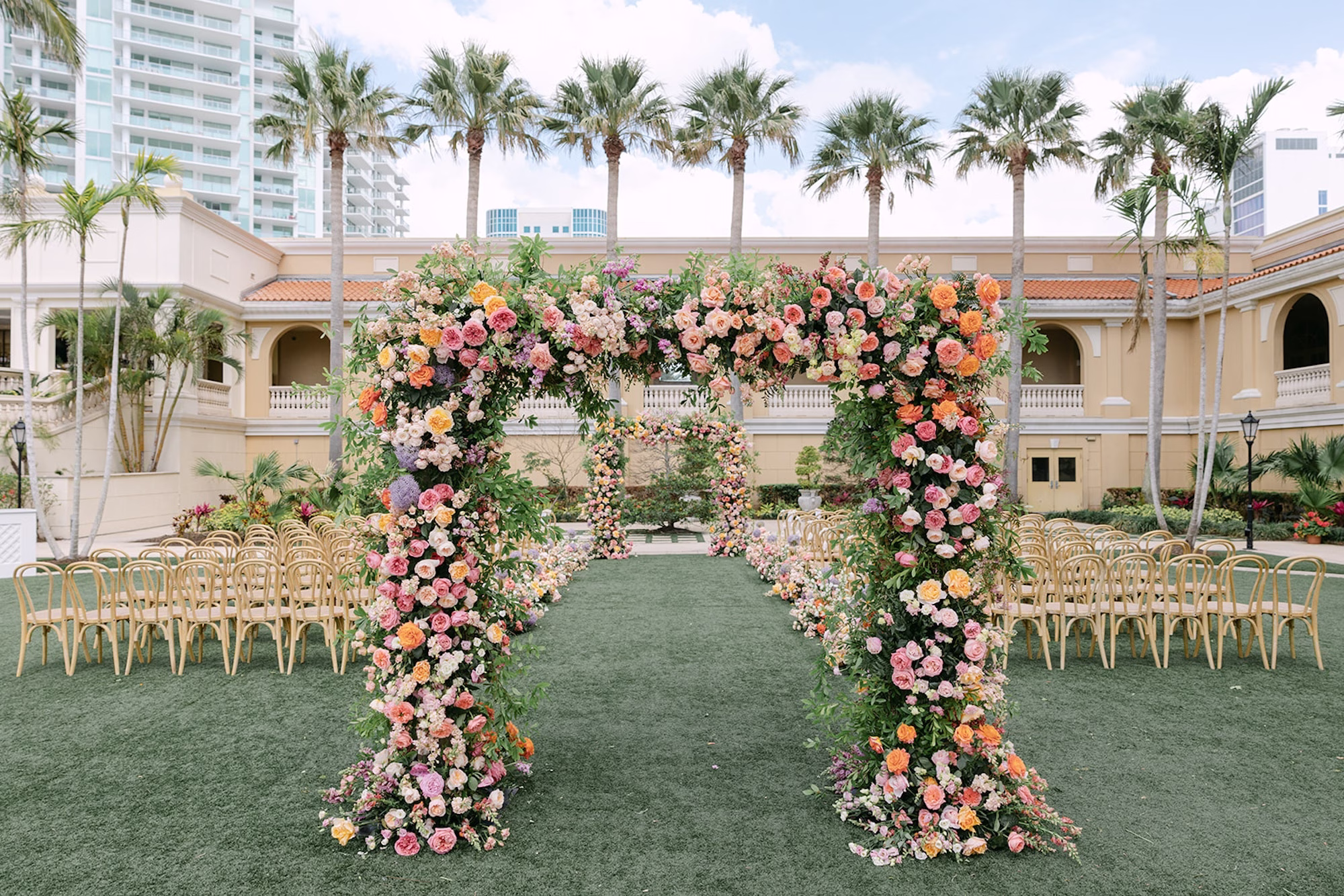 33Luxurious Whimsical Colorful Tented Florida Wedding Ritz Carlton Sarasota - Luxurious, Pastel Garden Tented Wedding | Ritz Carlton Sarasota Outdoor Whimsical Colorful Garden Wedding Ceremony Ideas | Vibrant Romantic Garden Floral Altar Arch of Pastel Blush, Pink, Cream, Peach, Lavender Roses, Peonies and Hydrangeas Floral Wedding Ceremony Decor Inspiration | Event Venue Ritz Carlton Sarasota | Tampa Bay Planner MDP Events