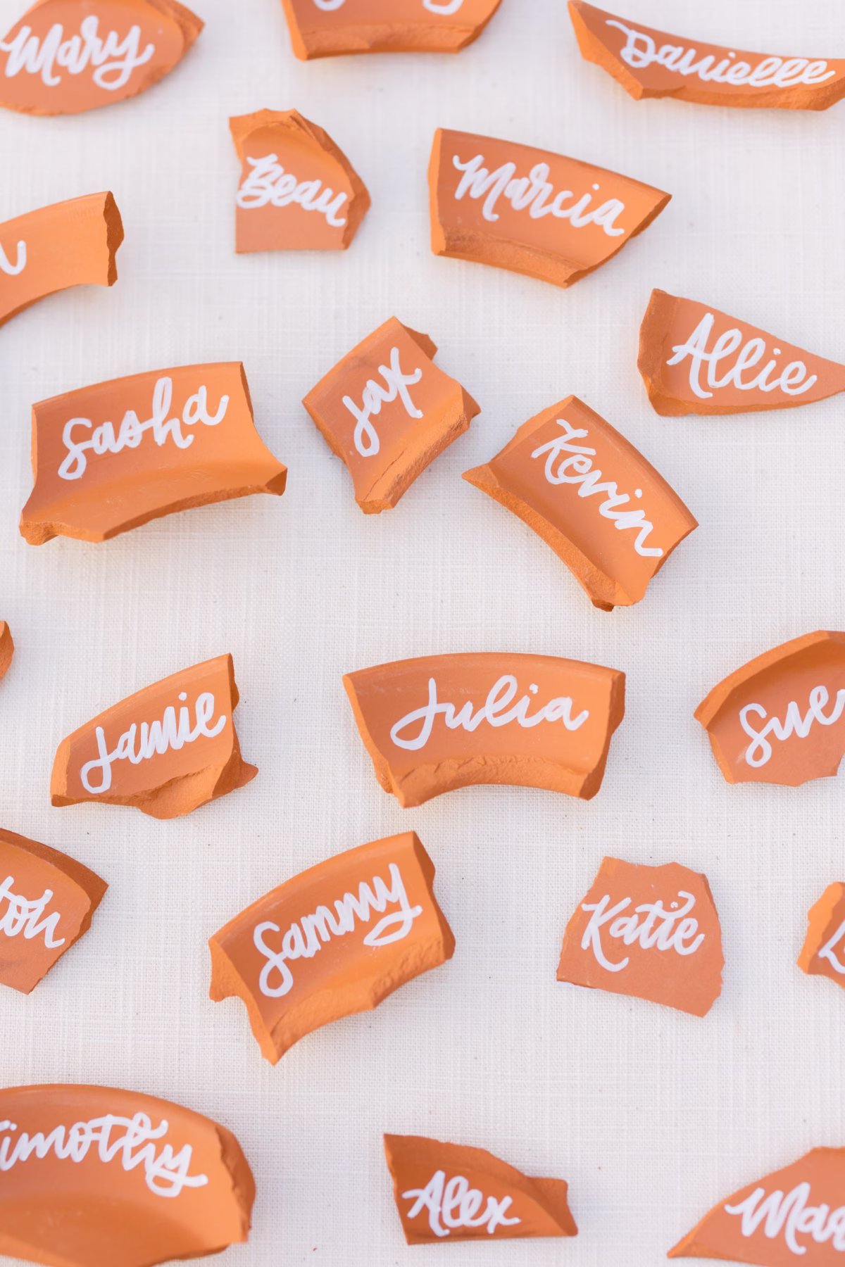 Modern Tropical Orange and Terracotta wedding Reception Place Card Ideas | St Pete Beach Calligraphy MadWOLFE Designs