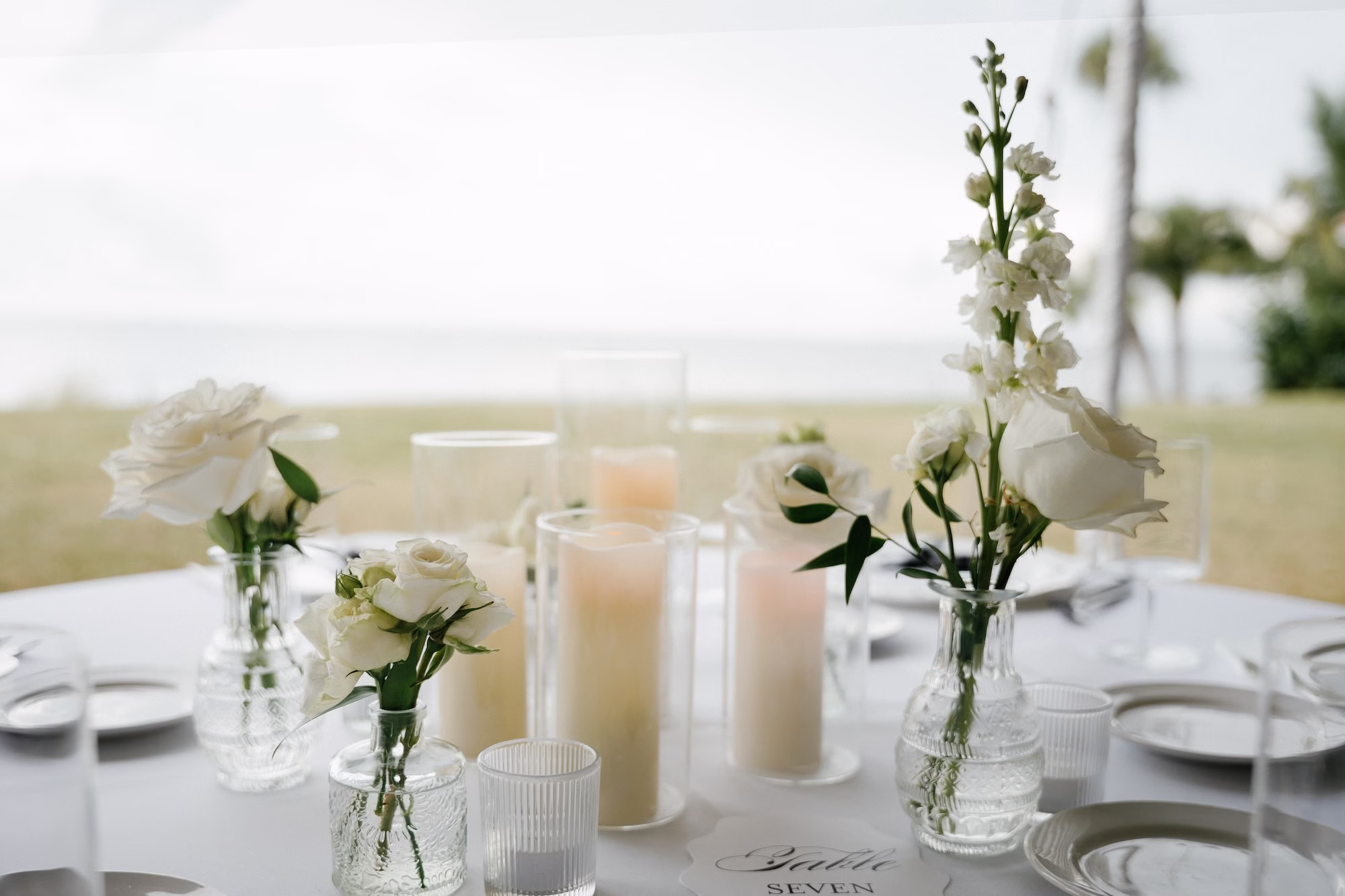 Elegant Black and White Outdoor Fall Tented Florida Wedding Reception Inspiration | Simple Bud Vases with Single Stem White Roses Centerpiece Tablescape Decor Ideas | Tampa Bay Florist Save The Date Florida | Sarasota Planner B Eventful