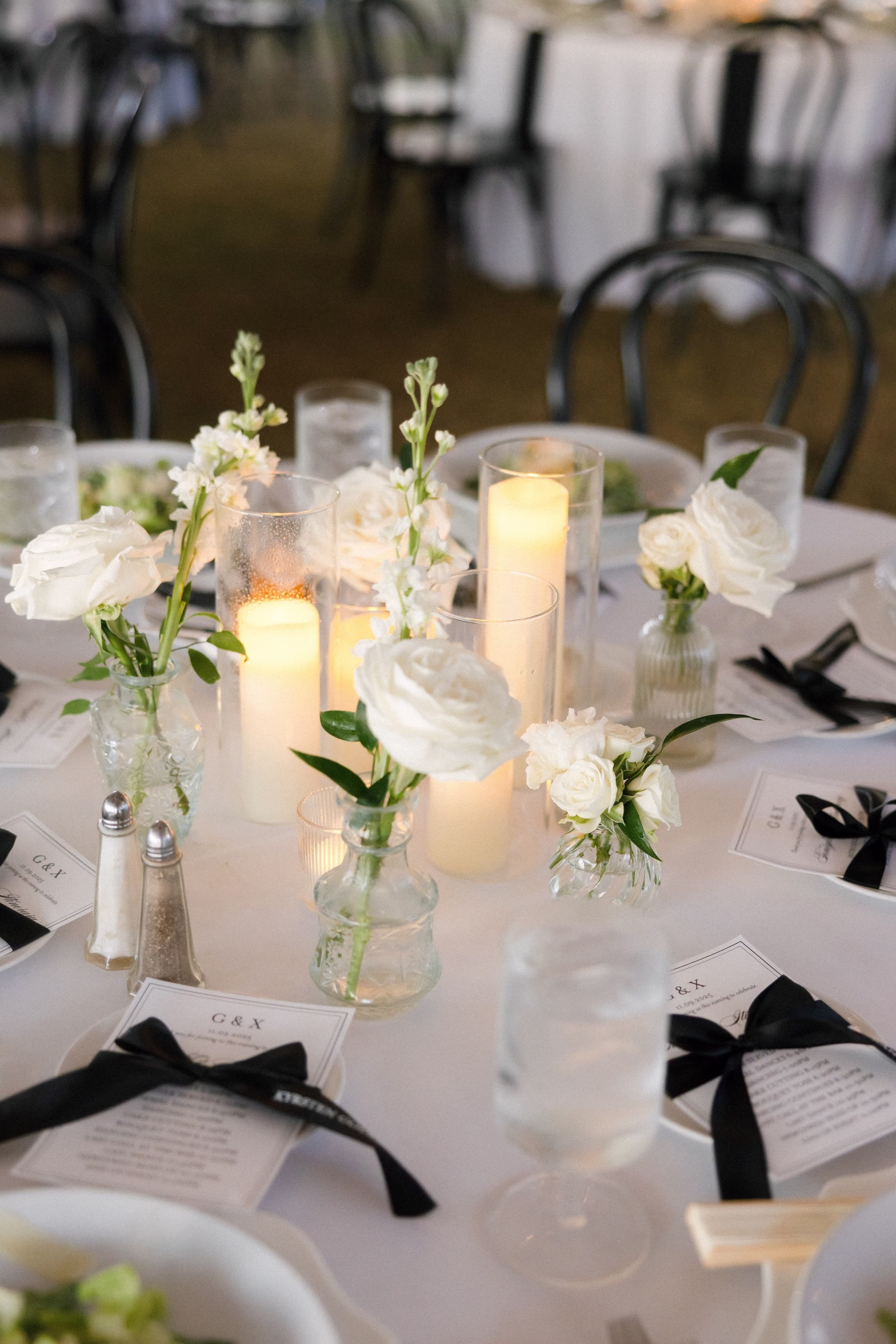 Elegant Black and White Outdoor Fall Tented Florida Wedding Reception Inspiration | Simple Bud Vases with Single Stem White Roses Centerpiece Tablescape Decor Ideas | Tampa Bay Florist Save The Date Florida | Sarasota Planner B Eventful