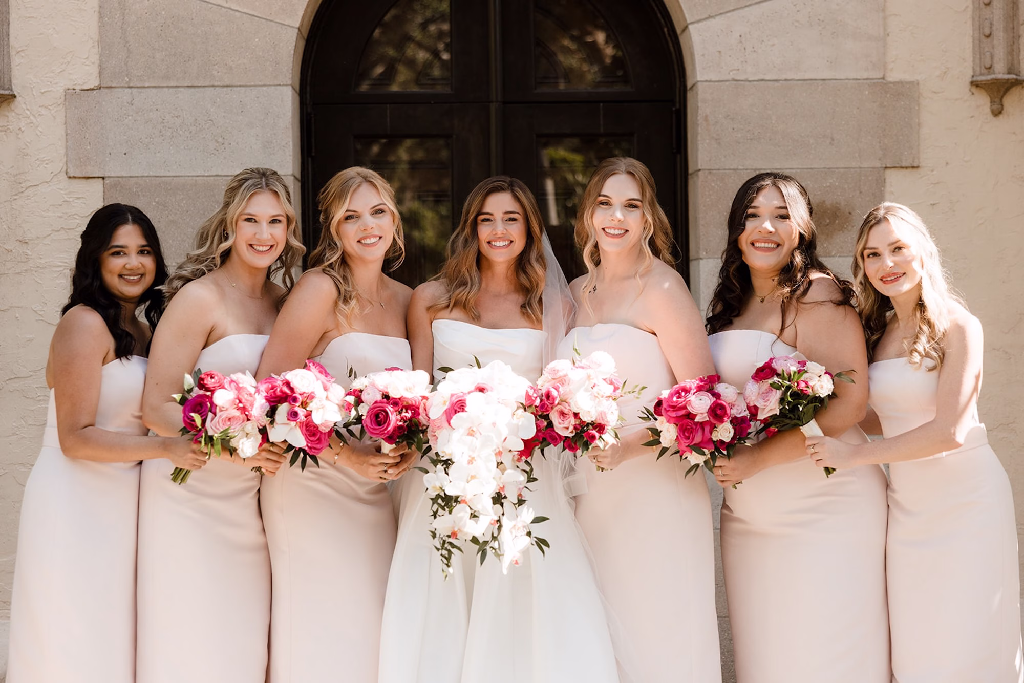 41Romantic Pink and Gold Waterfront Florida Wedding - Vibrant Pink and Gold Multicultural Sarasota Wedding | Powel Crosley Estate Bride with Bridesmaids Wedding Portrait | White Orchid and Pink Roses Bridal Bouquet Inspiration | Fitted Full Skirt White Strapless Kelly Faetanini Wedding Gown Ideas | Pink and Blush Roses Bouquet Inspiration | Strapless Blush Bridesmaid Dresses Ideas | Tampa Bay Photographer Evoke Photo and Film