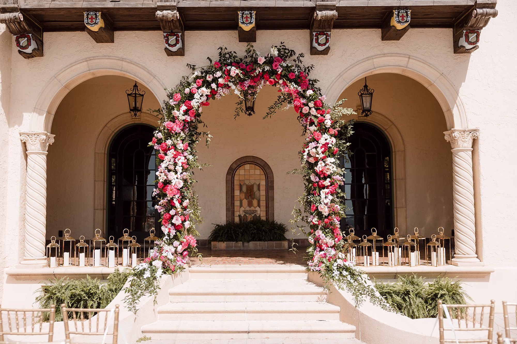48Romantic Pink and Gold Waterfront Florida Wedding Sarasota Venue Powel Crosley Estate - Vibrant Pink and Gold Multicultural Sarasota Wedding | Powel Crosley Estate Garden Romantic Outdoor Wedding Ceremony | Lush Full-Length Floral Arch with Pink, Red and Blush Roses, Hydrangeas and Greenery Reception Decor Inspiration | Sarasota Wedding Venue Powel Crosley Estate