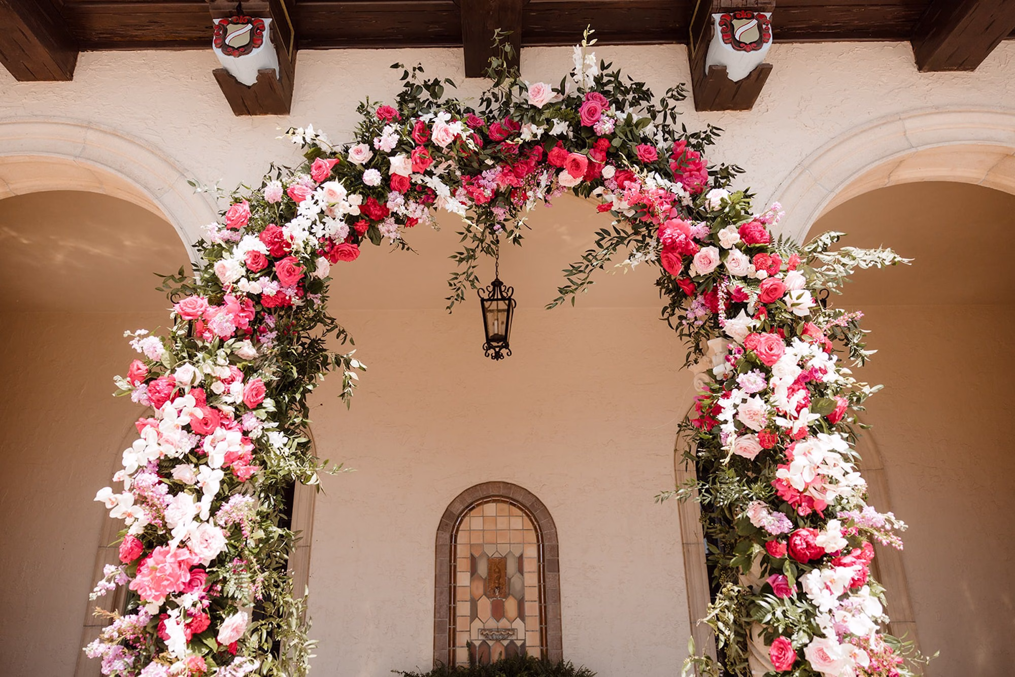 52Romantic Pink and Gold Waterfront Florida Wedding - Vibrant Pink and Gold Multicultural Sarasota Wedding | Powel Crosley Estate Garden Romantic Outdoor Wedding Ceremony | Lush Full-Length Floral Arch with Pink, Red and Blush Roses, Hydrangeas and Greenery Reception Decor Inspiration | Sarasota Wedding Venue Powel Crosley Estate