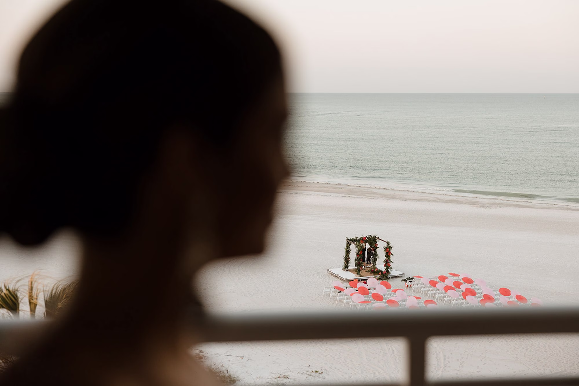 5Tropical Pink and Red Sarasota Beach Indian Wedding Ceremony Venue The Resort at Longboat Key Club - Vibrant Pink and Gold Multicultural Sarasota Wedding | Powel Crosley Estate Beach Oceanfront Wedding Ceremony Inspiration | White Ceremony Chairs with Rose Petal Aisle Decor Ideas | Red and Pink Delicate Umbrellas Parasails Favor Ideas | Sarasota Beach Event Venue The Resort at Longboat Key Club | Photographer Evoke Photo and Film