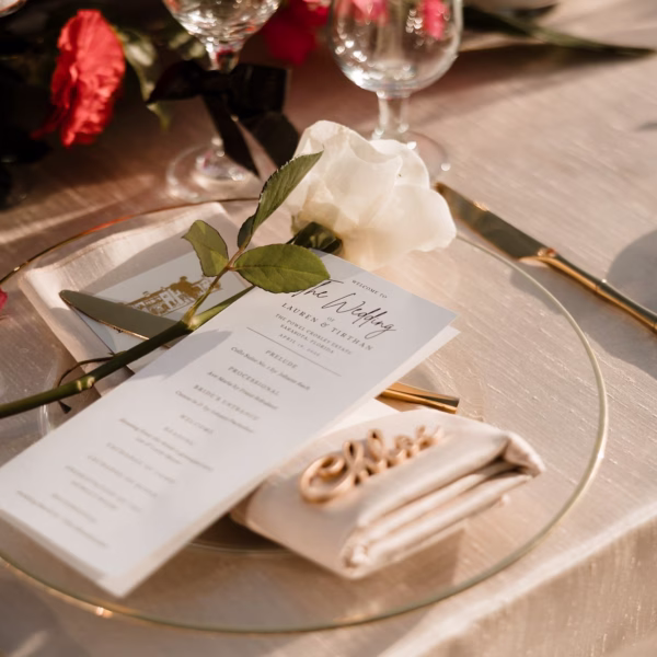 74Romantic Pink and Gold Waterfront Florida Wedding - Vibrant Pink and Gold Multicultural Sarasota Wedding | Powel Crosley Estate Garden Romantic Outdoor Wedding Reception | Gold Neutral Table Linens with Clear, Gold Rimmed Charger and Gold Cutlery Tablescape Decor Inspiration | White Rose with White Menu Card and Tan, Gold Napkin Reception Decor Ideas