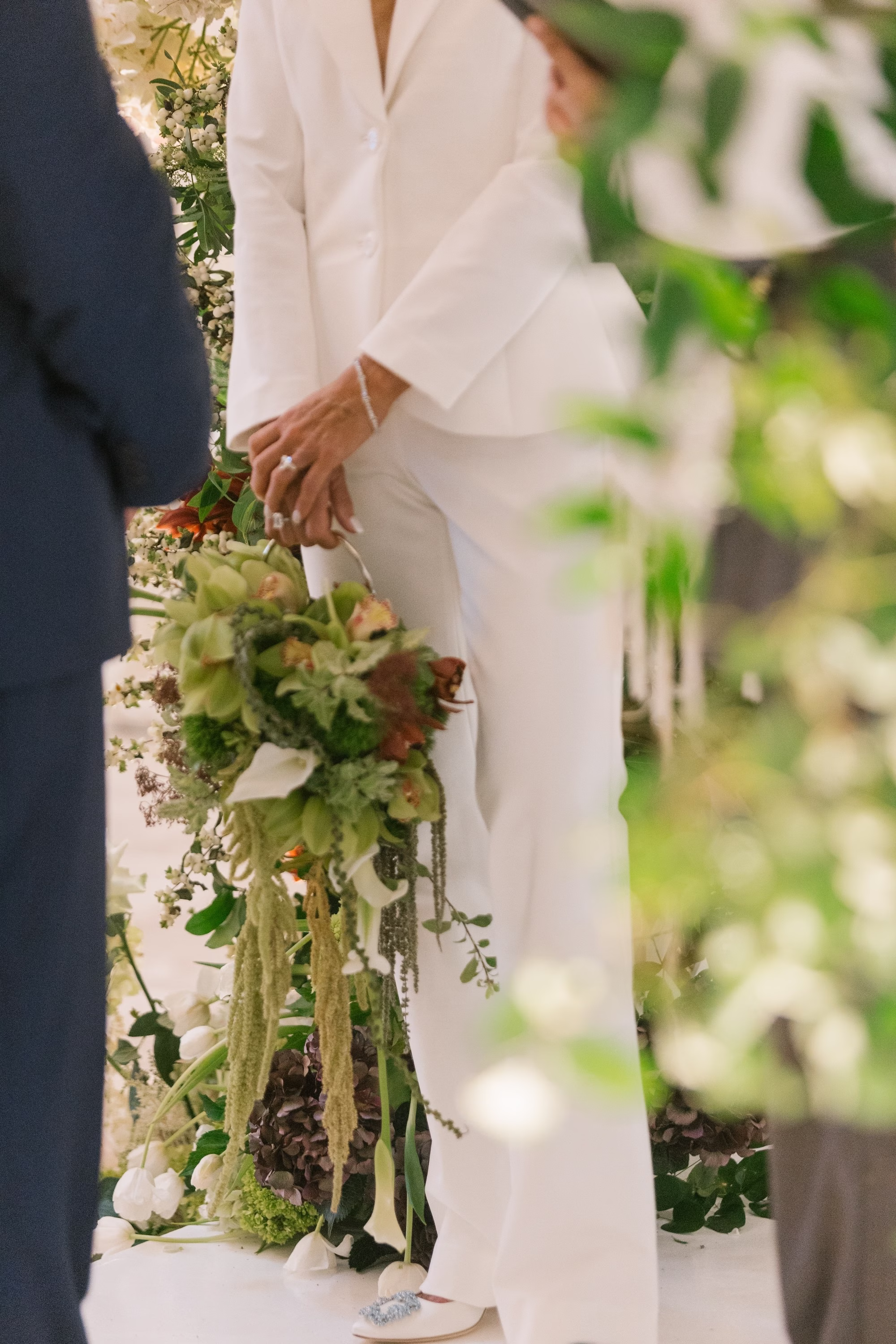 Elegant White and Green Cascading Wedding Bridal Bouquet Purse of Calla Lilies, Orchids, Amaranthus Inspiration | Modern Alice and Olivia White Wedding Bridal Suit Ideas