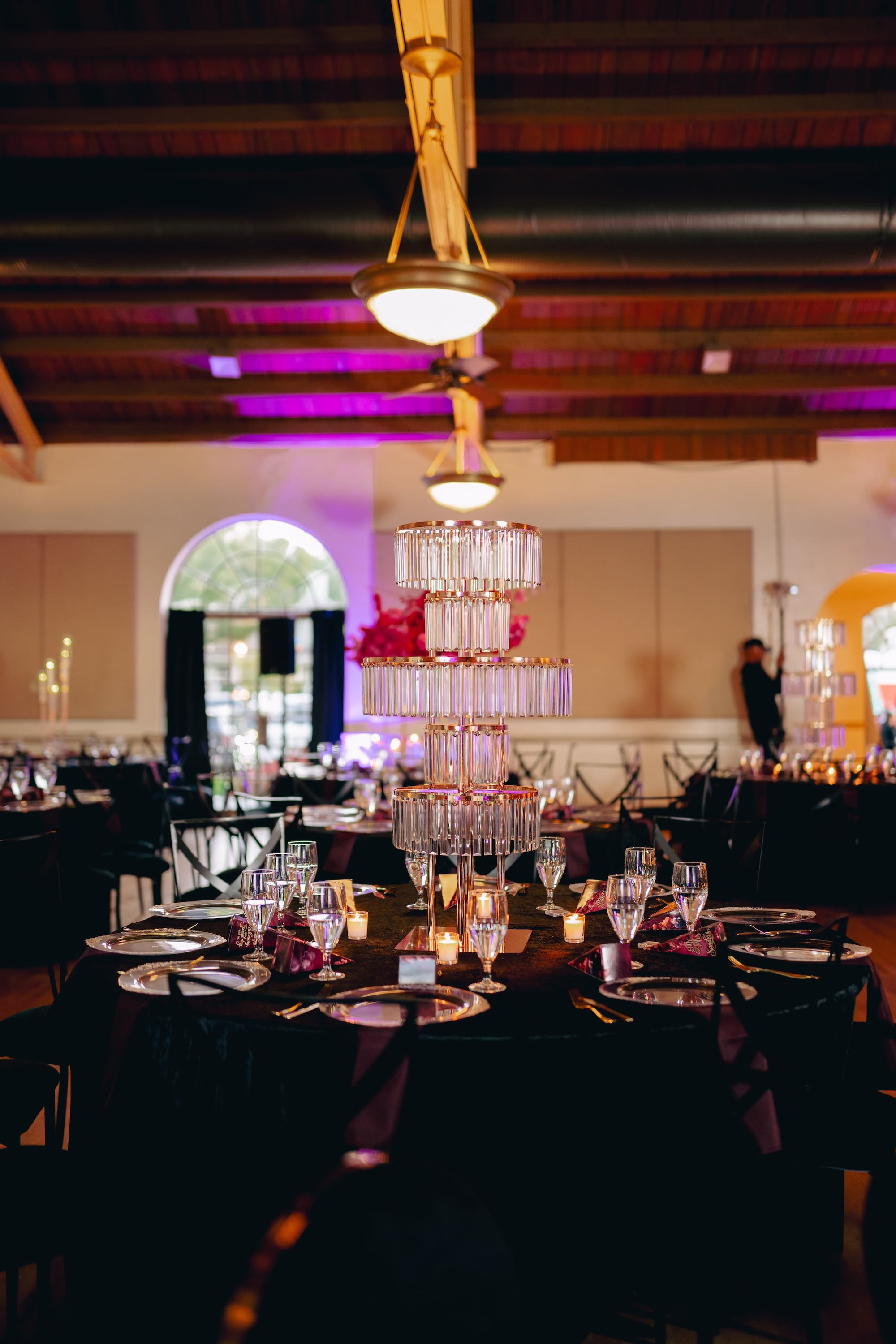 29Bold Pink Red and Burgundy Wedding Ideas - Glamorous, Burgundy Lakeland Wedding | Lake Mirror Amphitheater Glamourous Pink, Red, Burgundy and Black Ballroom Wedding Reception Decor Inspiration | Multi-Tiered Crystal Tube Chandelier Wedding Reception Centerpiece Decor Ideas | Black Velvet Table Linens Decor Inspiration | Clear Glass Charger with Gold Rims and Black Napkins in Gold Napkin Ring Tablescape Decor Ideas