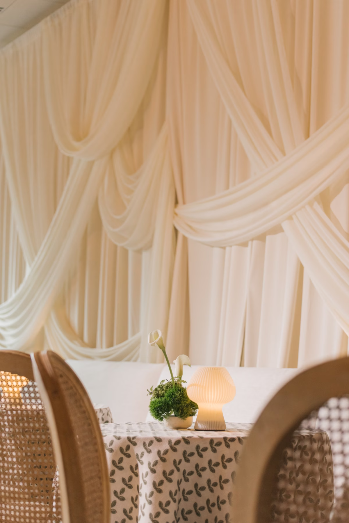 Timeless Minimalist Cream and Light Green Wedding Reception Decor Inspiration | Neutral Sophisticated Wedding Reception Tablescape Decor Ideas | Table Lamp with Simple Green and White Orchid Floral Arrangement Centerpiece Inspiration | St Pete Planner Stelloccasions Weddings and Events