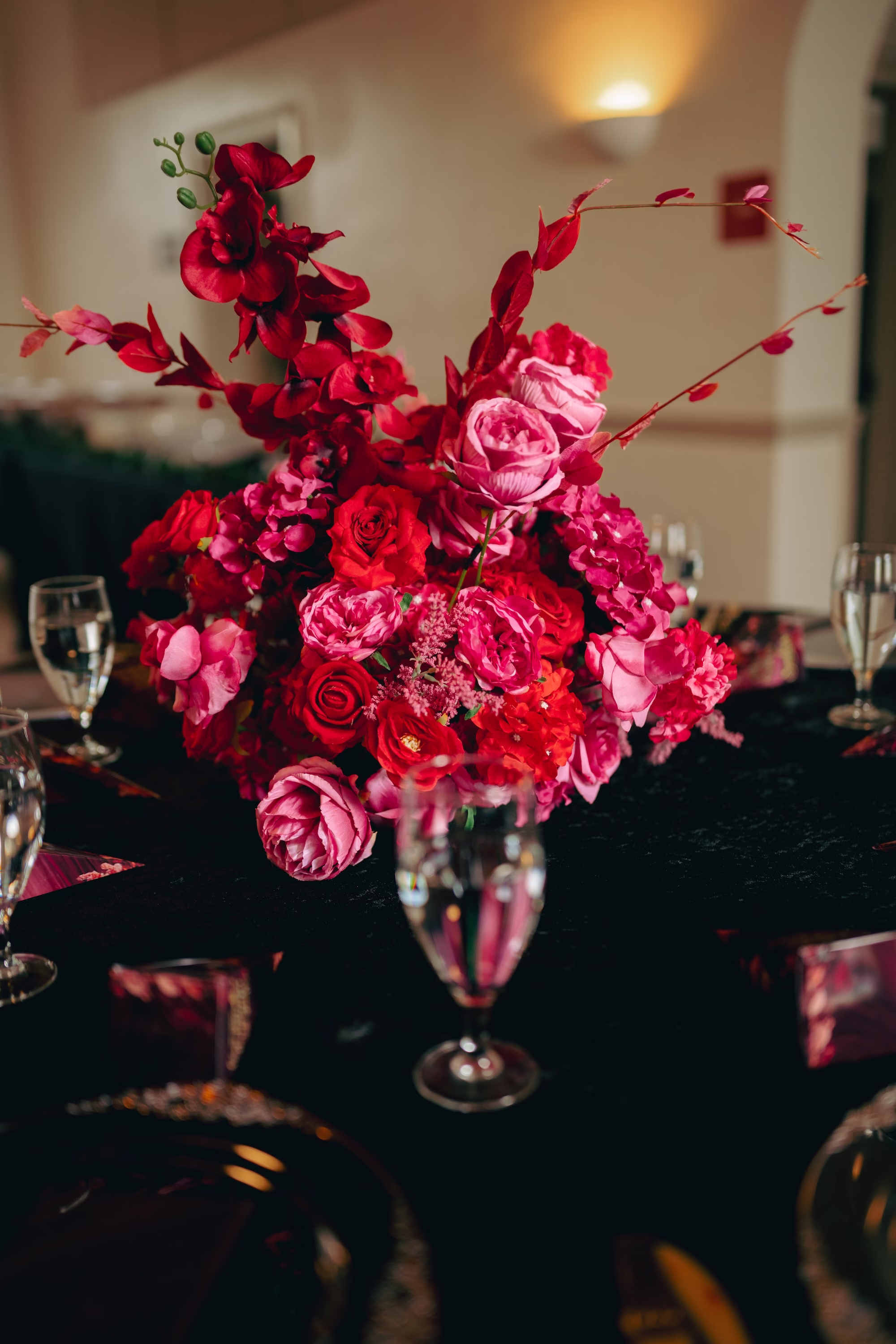35Bold Pink Red and Burgundy Wedding Ideas - Glamorous, Burgundy Lakeland Wedding | Lake Mirror Amphitheater Dark Romantic Black, Red, Pink, Burgundy Wedding Reception Decor Inspiration | Luxurious Hot Pink, Deep Red, Dark Burgundy Rose Wedding Reception Centerpiece Flower Arrangement Ideas