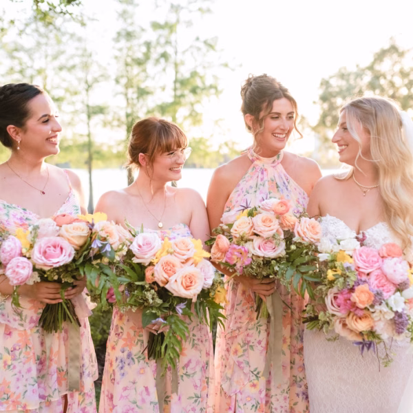 Bride and Bridesmaids Wedding Portrait | White Strapless Wedding Gown Inspiration | Mismatched Pink Pastel Floral Bridesmaids Dresses Ideas | Pastel Roses and Peonies Bouquet Inspiration | Tampa Boutique Truly Forever Bridal
