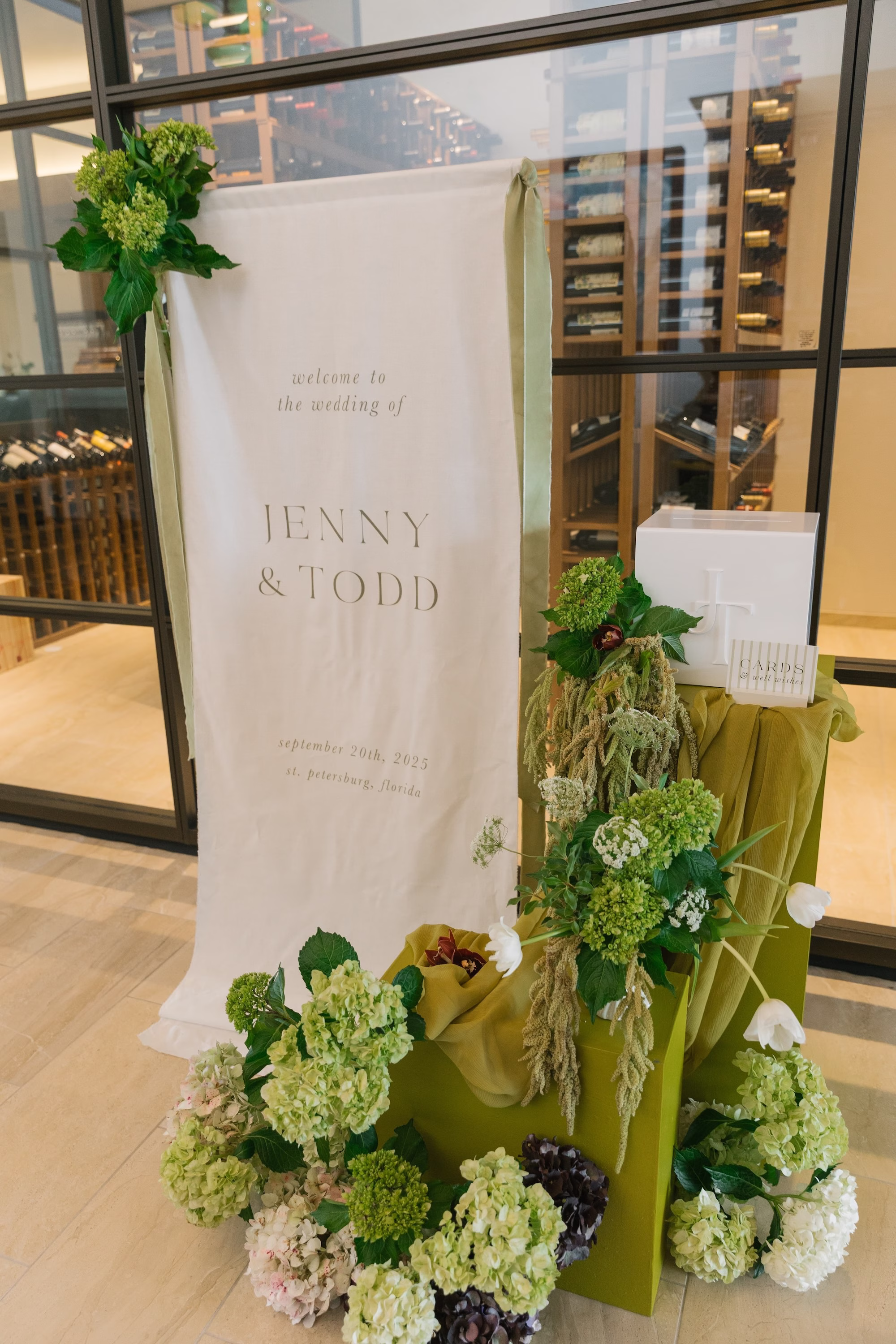 White Linen Modern Minimalist Wedding Reception Welcome Sign Inspiration | White and Green Flower Arrangements of Hydrangeas, Amaranthus, Roses Decor Ideas | St Pete Planner Stelloccasions Weddings and Events