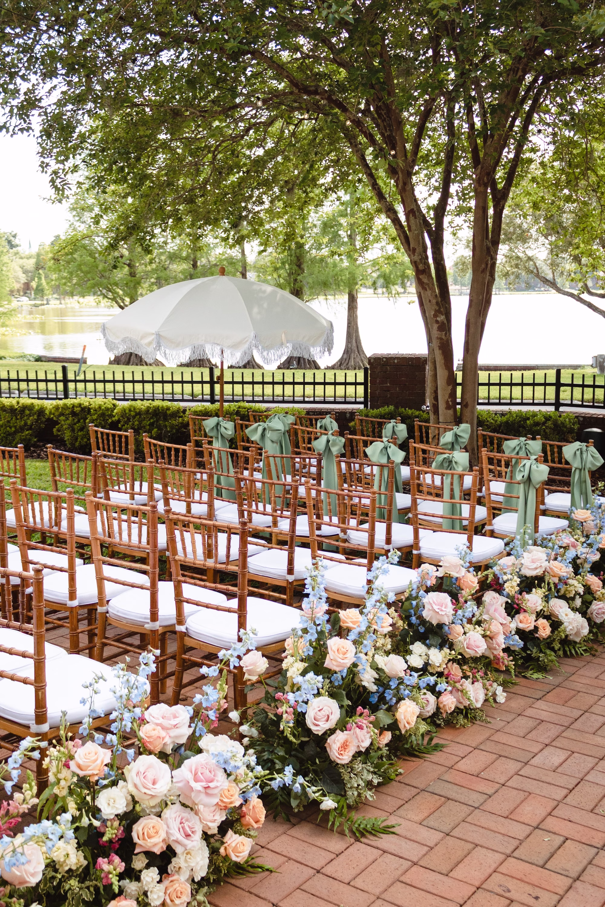 Romantic Pastel Spring Wedding Ceremony | Wooden Chiavari Chairs by Tampa Rentals A Chair Affair | Pastel Pink, Ivory, Cream, Lavender, Blue, Yellow Roses, Hydrangeas Floral Arrangement Wedding Ceremony Aisle Decor Inspiration