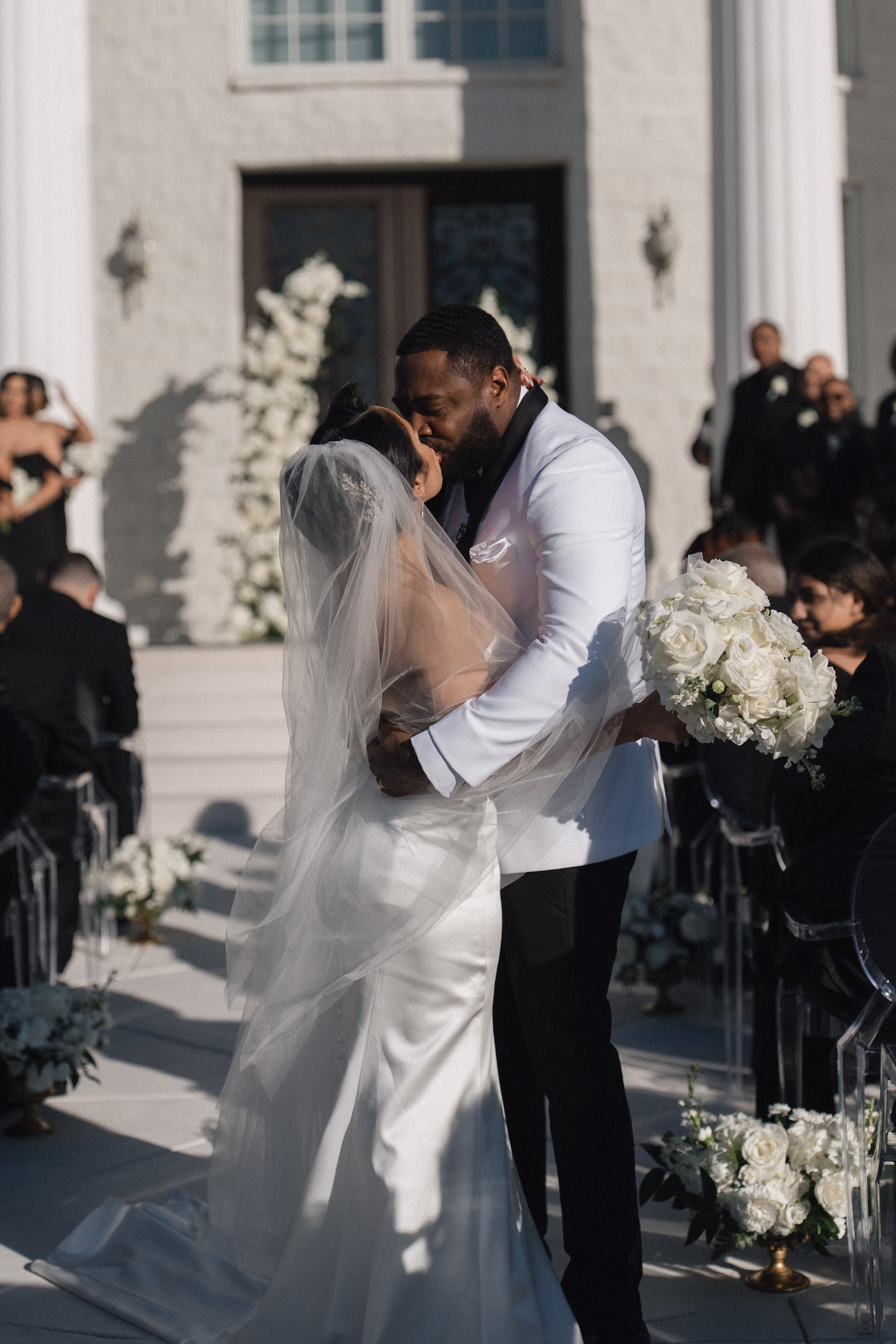 23Timeless Black and Wedding New Years Eve Wedding Ideas - Timeless Black and White Tarpon Springs Wedding | Whitehurst Gallery Bride and Groom Just Married Kiss in Wedding Ceremony Aisle Wedding Portrait | Black and White New Years Eve Wedding Ceremony Decor Inspiration | Monochromatic White Roses Bridal Bouquet Ideas | Tampa Bay Photographer Amber Yonker Photography