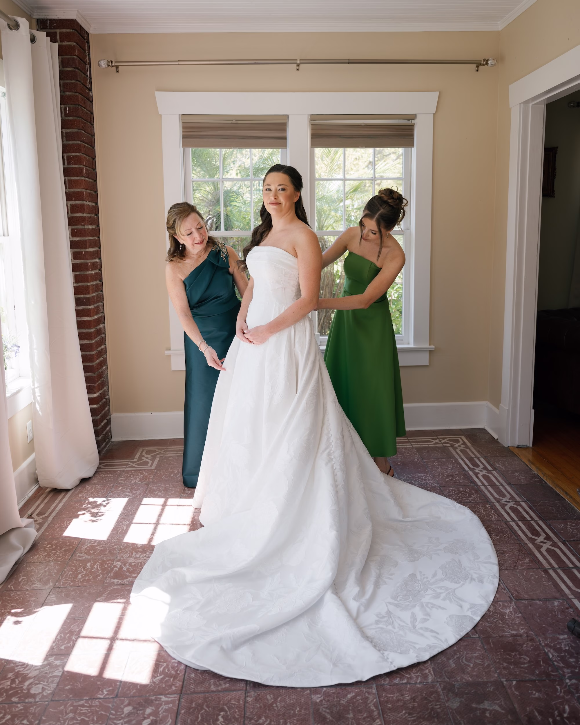 4Tropical Green Florida Wedding Ideas - Tropical, Green Downtown St. Pete Wedding | Poynter Institute Bride and Bridesmaid and Mother of Bride Getting Ready Wedding Portrait | Bright Green Bridesmaid Dress Inspiration | White Strapless Wedding Gown with Long Floral Detailed Train Ideas | Slicked Back Half Up Half Down Wedding Bridal Hair with Veil Inspiration | Florida Hair and Makeup Adore Bridal | Tampa Bay Photographer Dewitt For Love