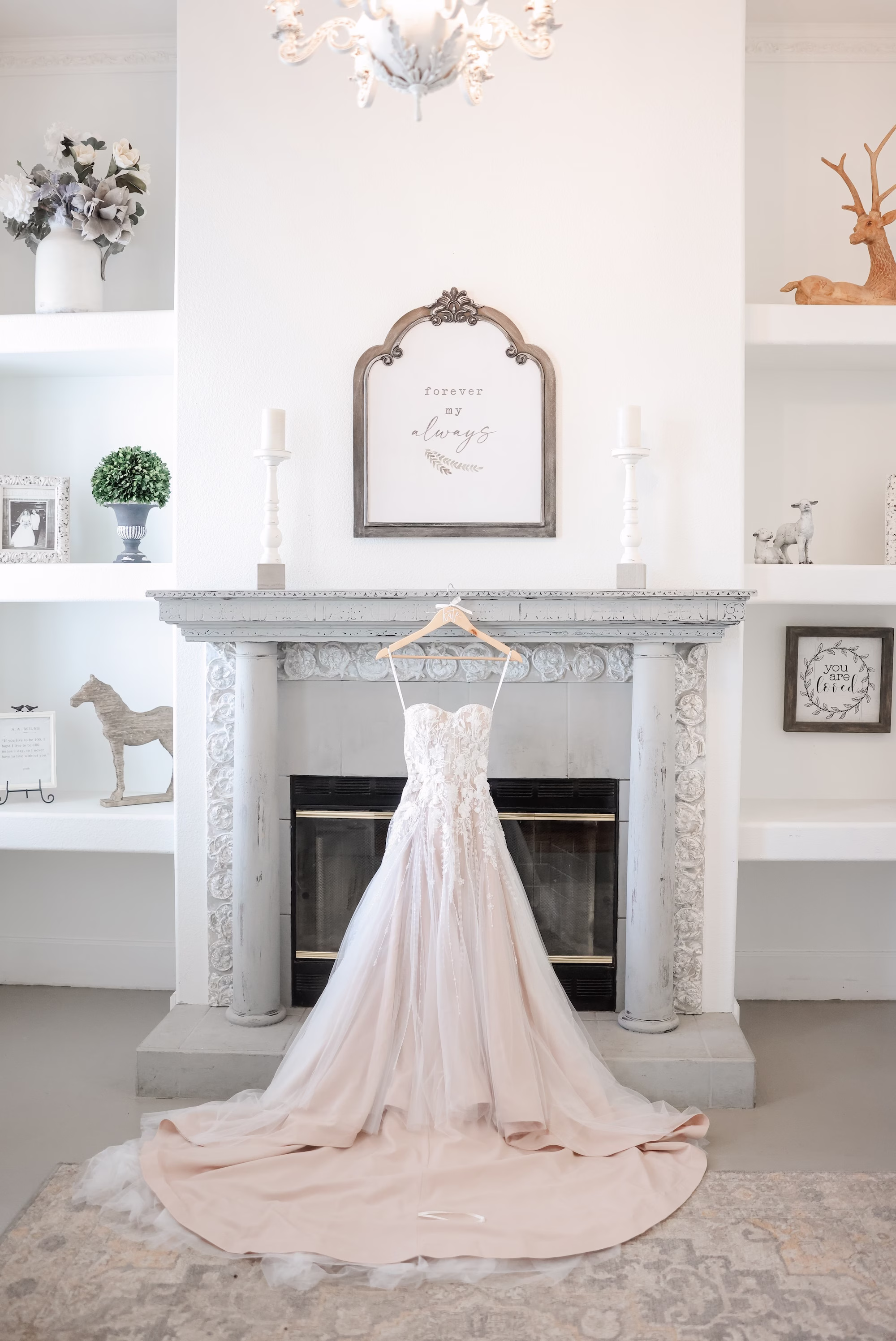 Strapless A Line Wedding Gown with Intricate Lace Detail and Dramatic Train hanging in front of Fire Place Wedding Portrait | Clearwater Photographer Lifelong Photography Studio | Tampa Bay Event Venue Legacy Lane Weddings