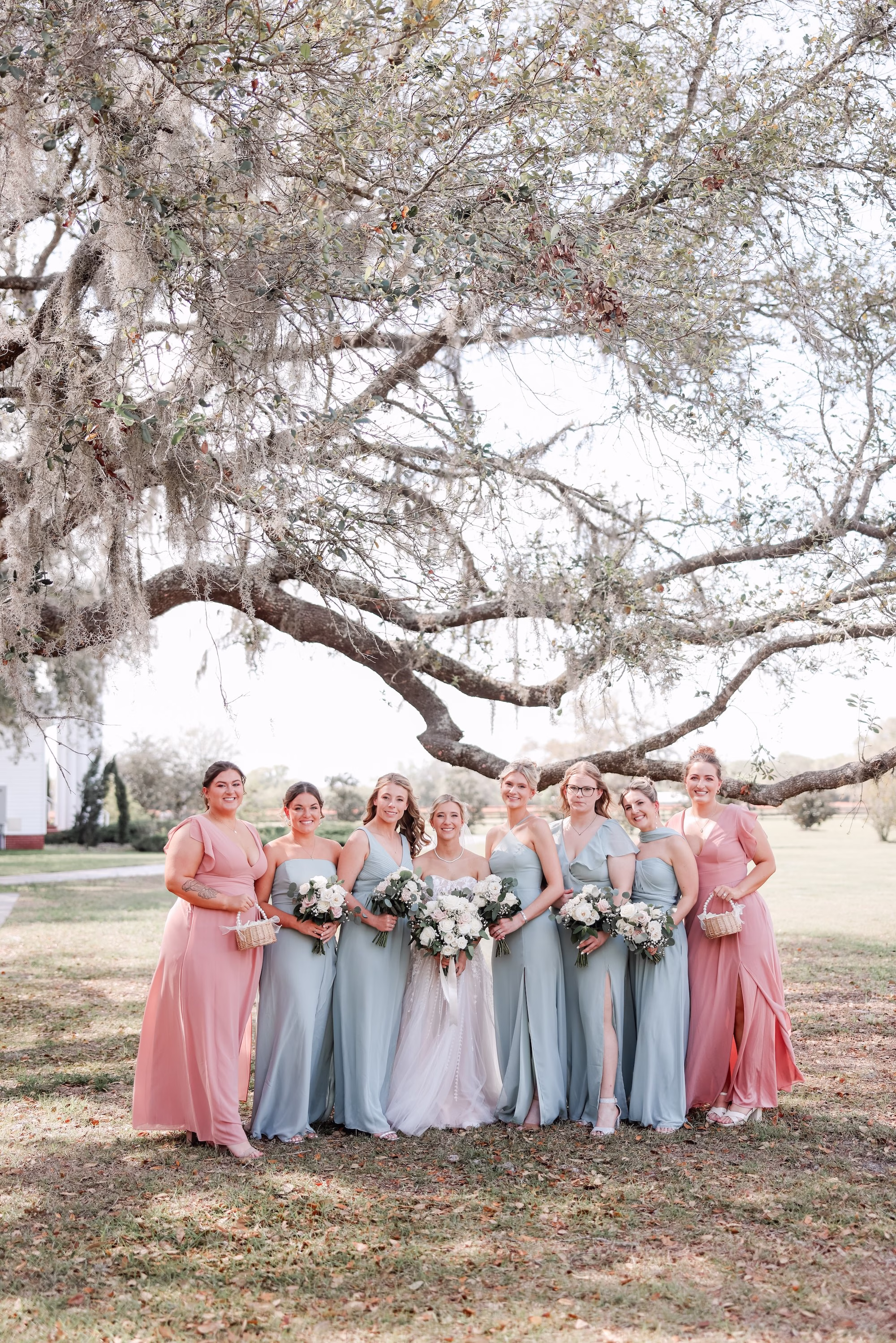 Bride and Bridesmaids Wedding Portrait | Sage Green Chiffon Bridesmaid Dress Inspiration | Classic White Roses Bouquet Ideas | Clearwater Photographer Lifelong Photography Studio | Tampa Bay Event Venue Legacy Lane Weddings