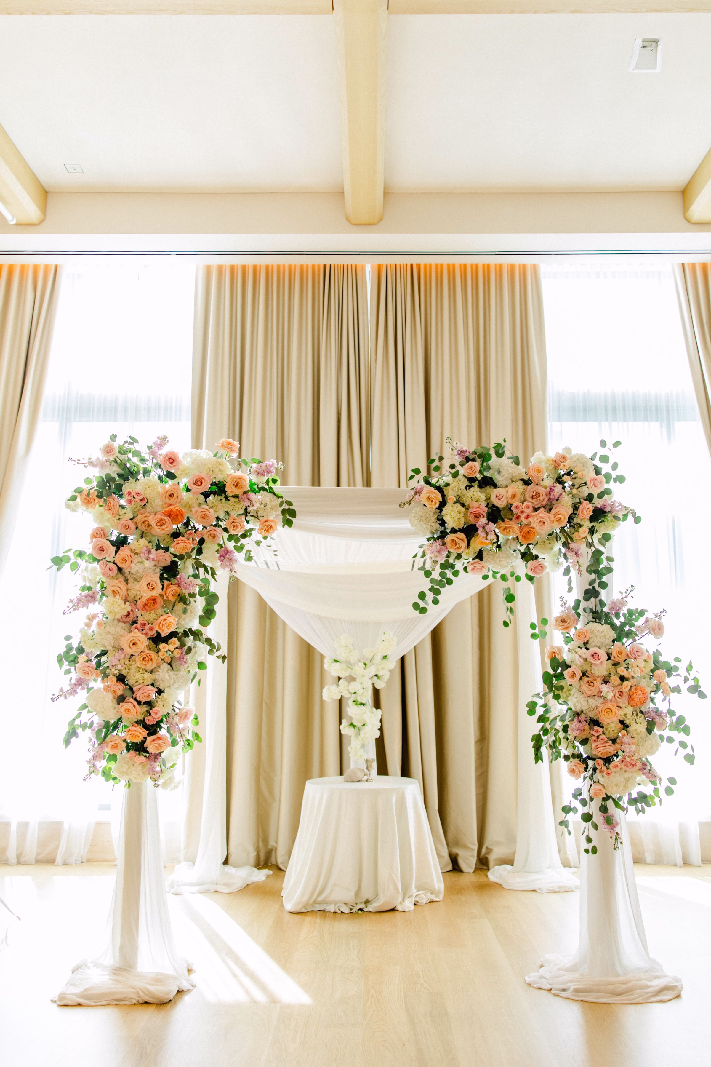 Spring Pastel Roses, Hydrangeas Blush, Peach, Cream, White Wedding Ceremony Floral Arrangement Decor Inspiration | White Draping Ceremony Decor Ideas | Downtown Event Venue The Edition Hotel Tampa