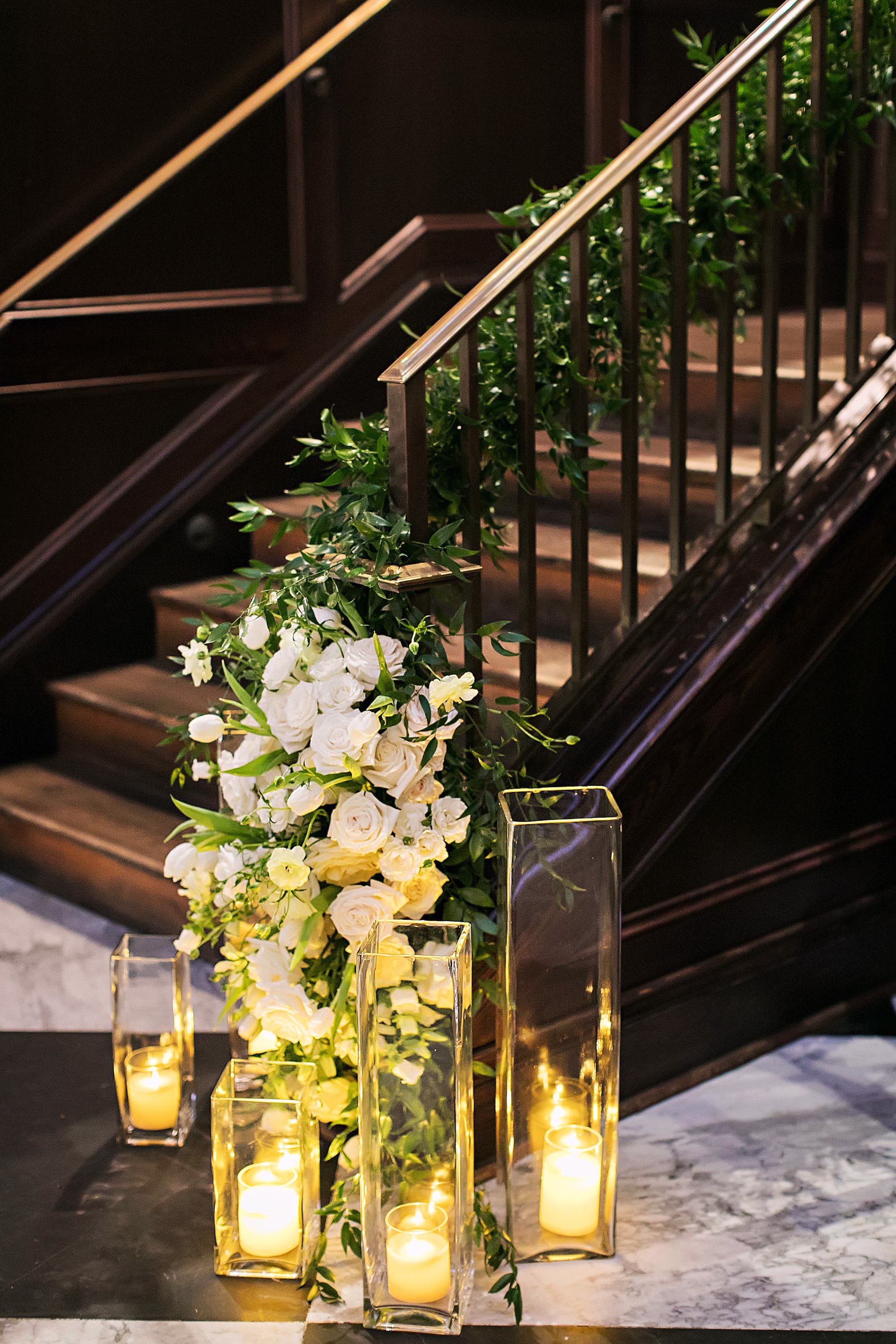 Elegant Black and White Wedding Reception Ceremony Decor Inspiration | Green Ivy Staircase Garland Decor Ideas | White Roses with Romantic Candlelight Decor Inspiration